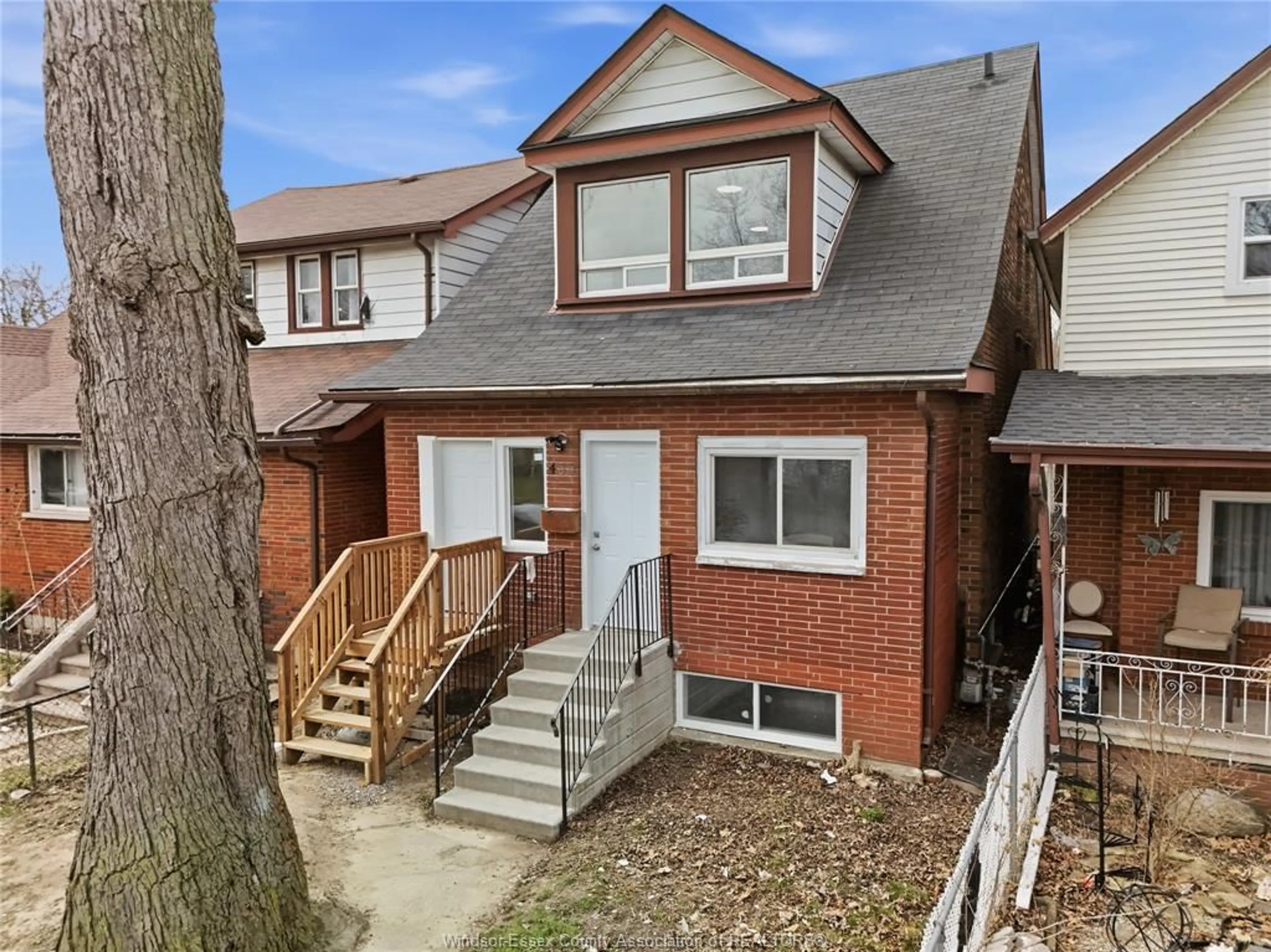 Home with brick exterior material, street for 435 CARON Ave, Windsor Ontario N8A 5B3