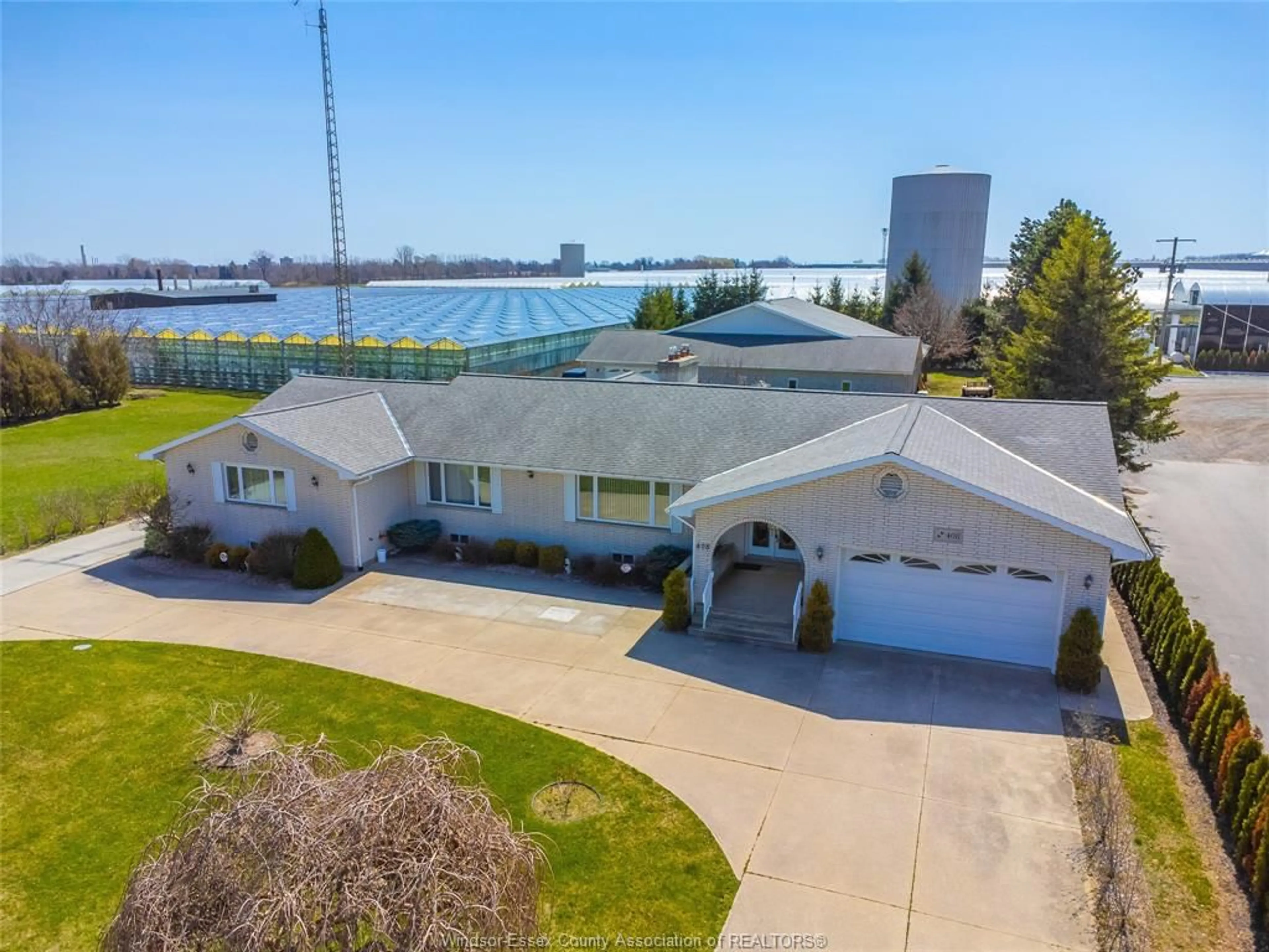 A pic from outside/outdoor area/front of a property/back of a property/a pic from drone, water/lake/river/ocean view for 408 MERSEA RD 3, Leamington Ontario N8H 3V5