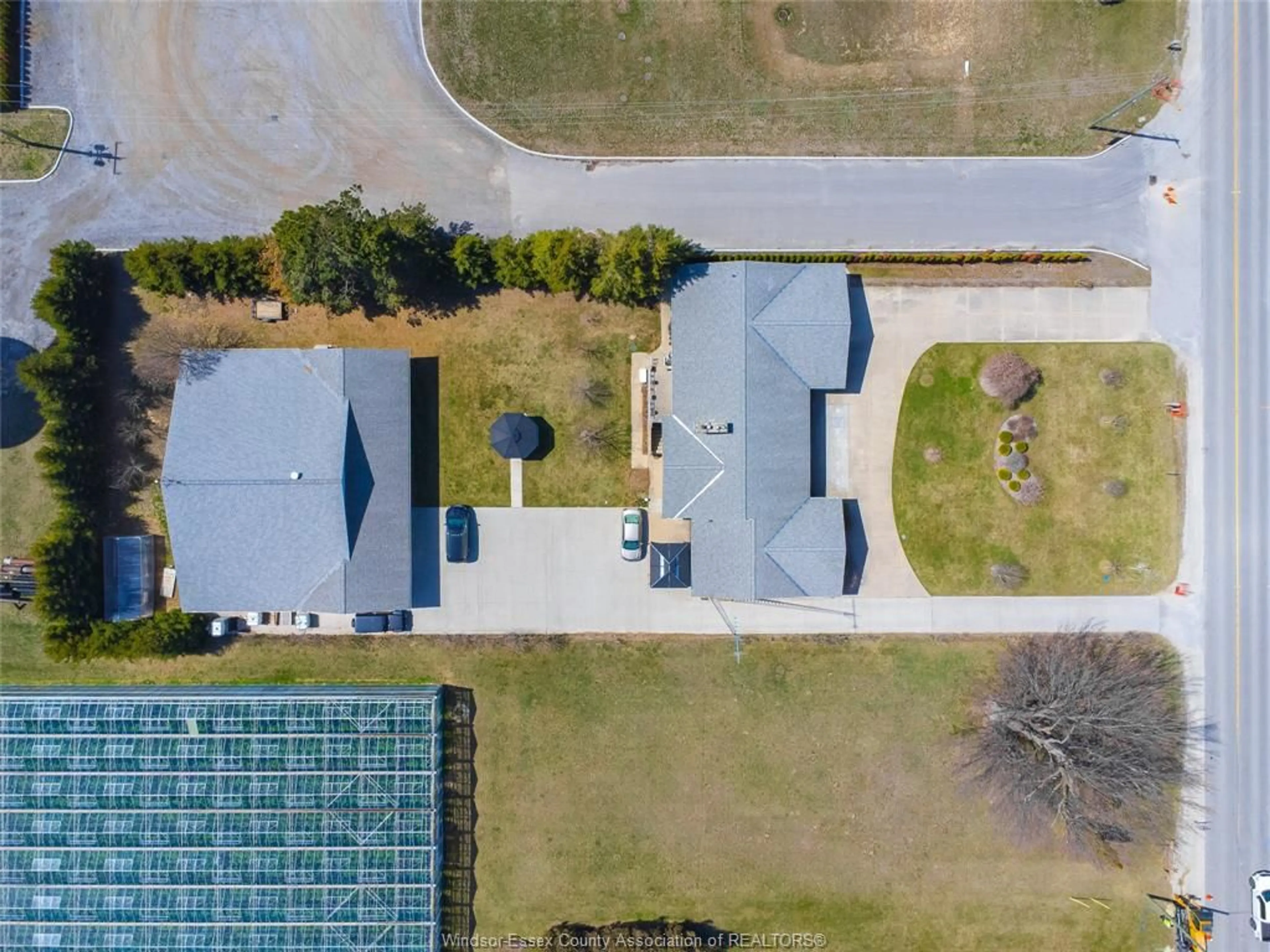 A pic from outside/outdoor area/front of a property/back of a property/a pic from drone, building for 408 MERSEA RD 3, Leamington Ontario N8H 3V5