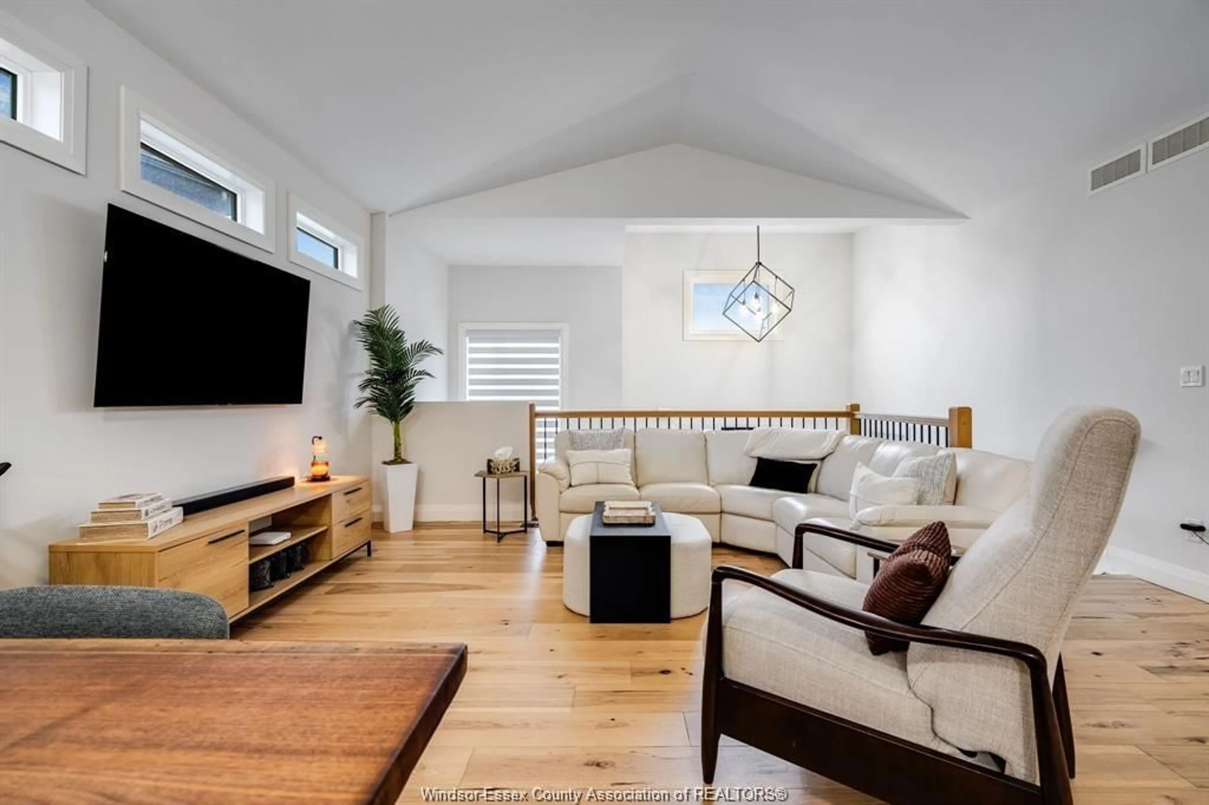 Living room with furniture, wood/laminate floor for 241 ROBINSON Ave, Essex Ontario N8M 0A8