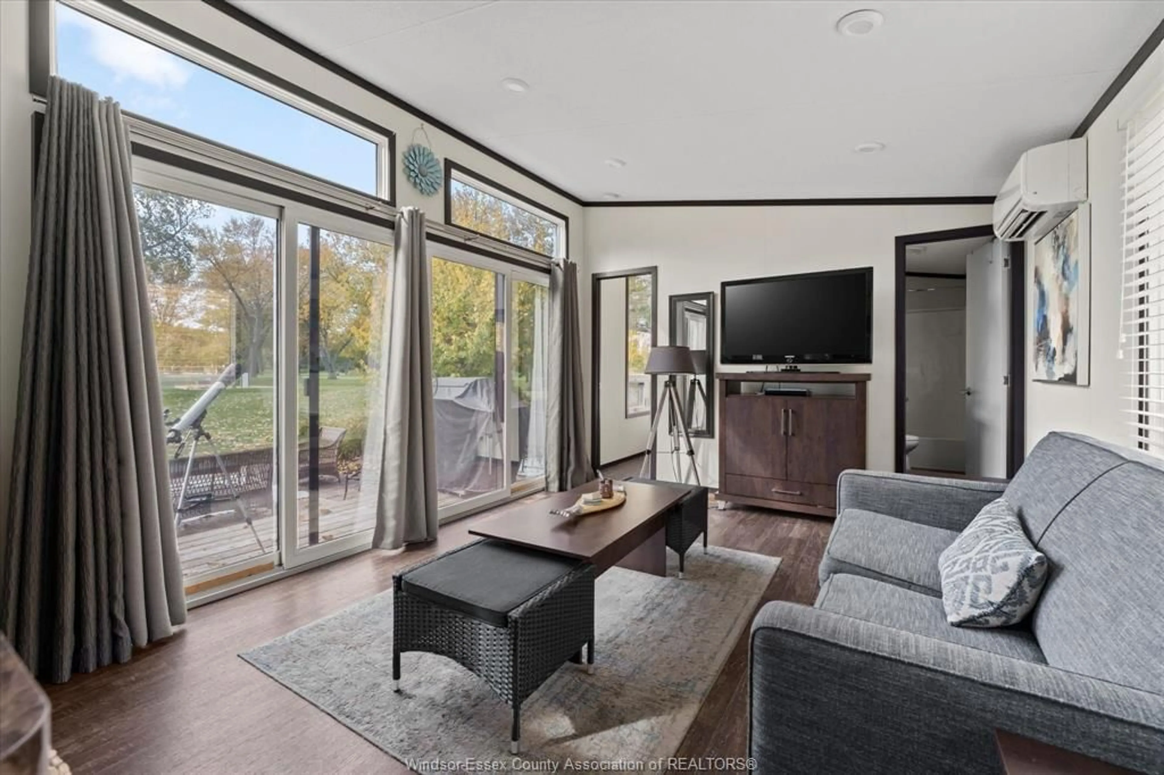 Living room with furniture, ceramic/tile floor for 981 COUNTY RD 2 #711, Lakeshore Ontario N8L 1B4