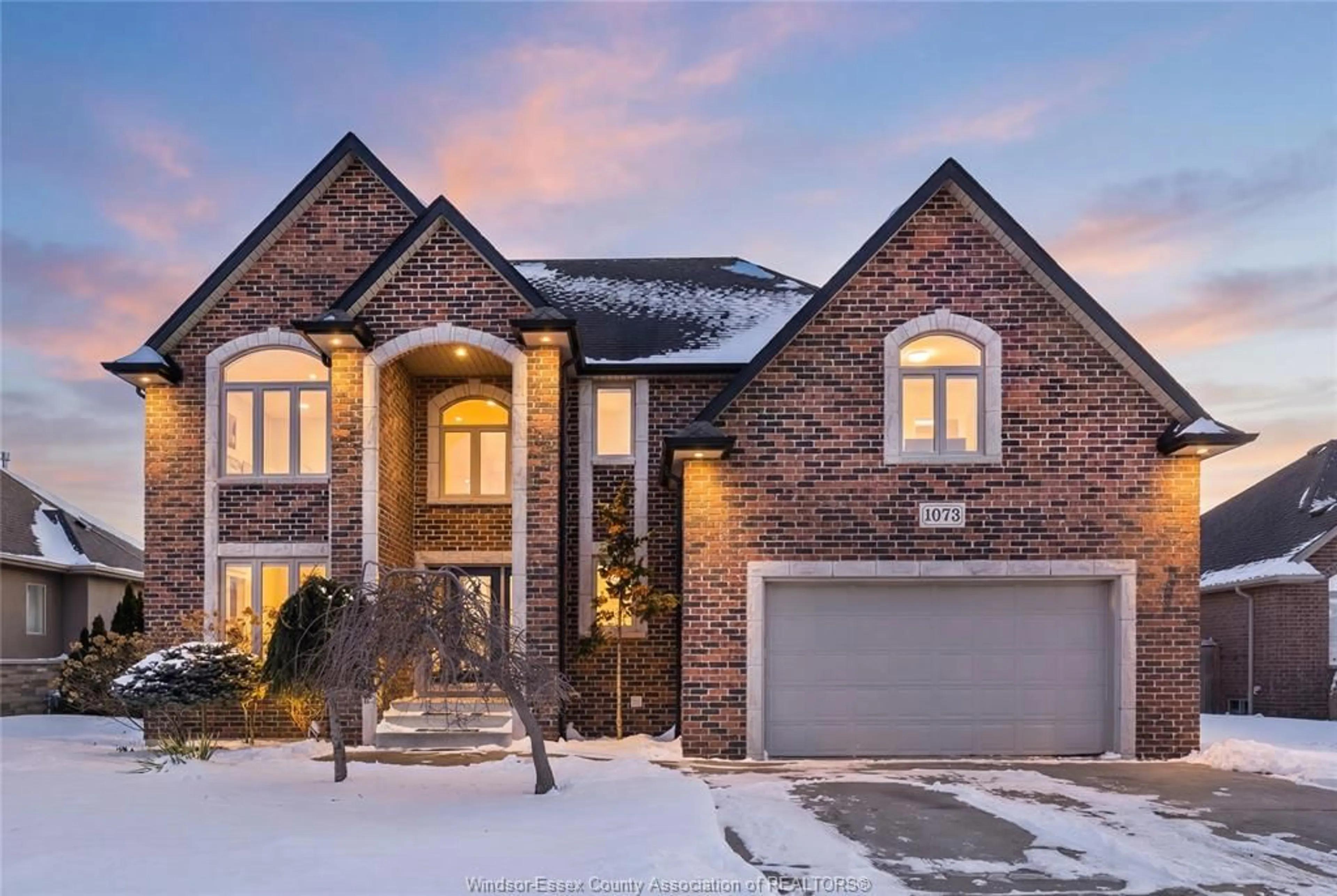 Home with brick exterior material, street for 1073 REGENCY Cres, Lakeshore Ontario N0R 1A0