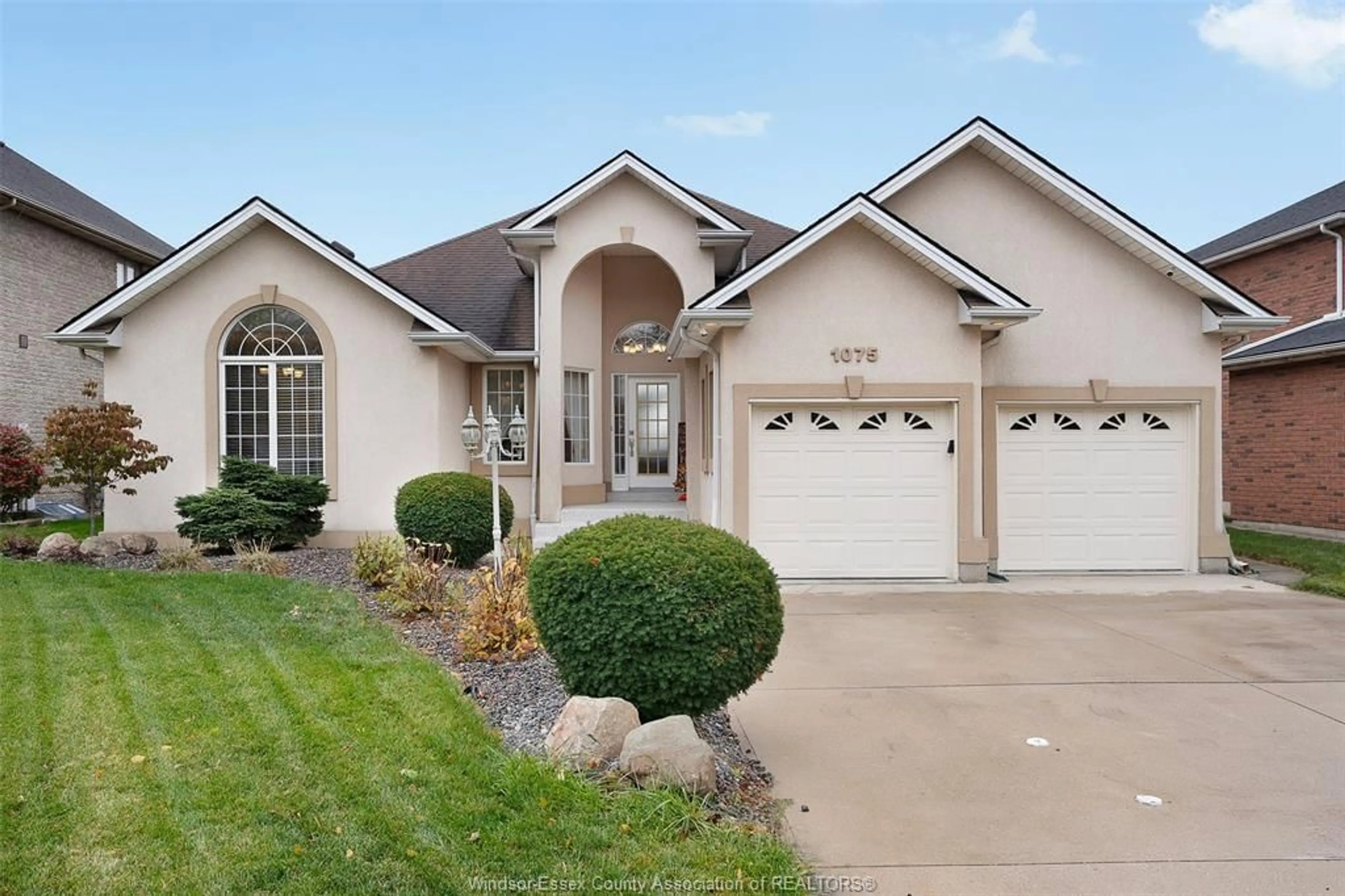 Home with vinyl exterior material, street for 1075 STONEYBROOK, Windsor Ontario N9G 2Y3