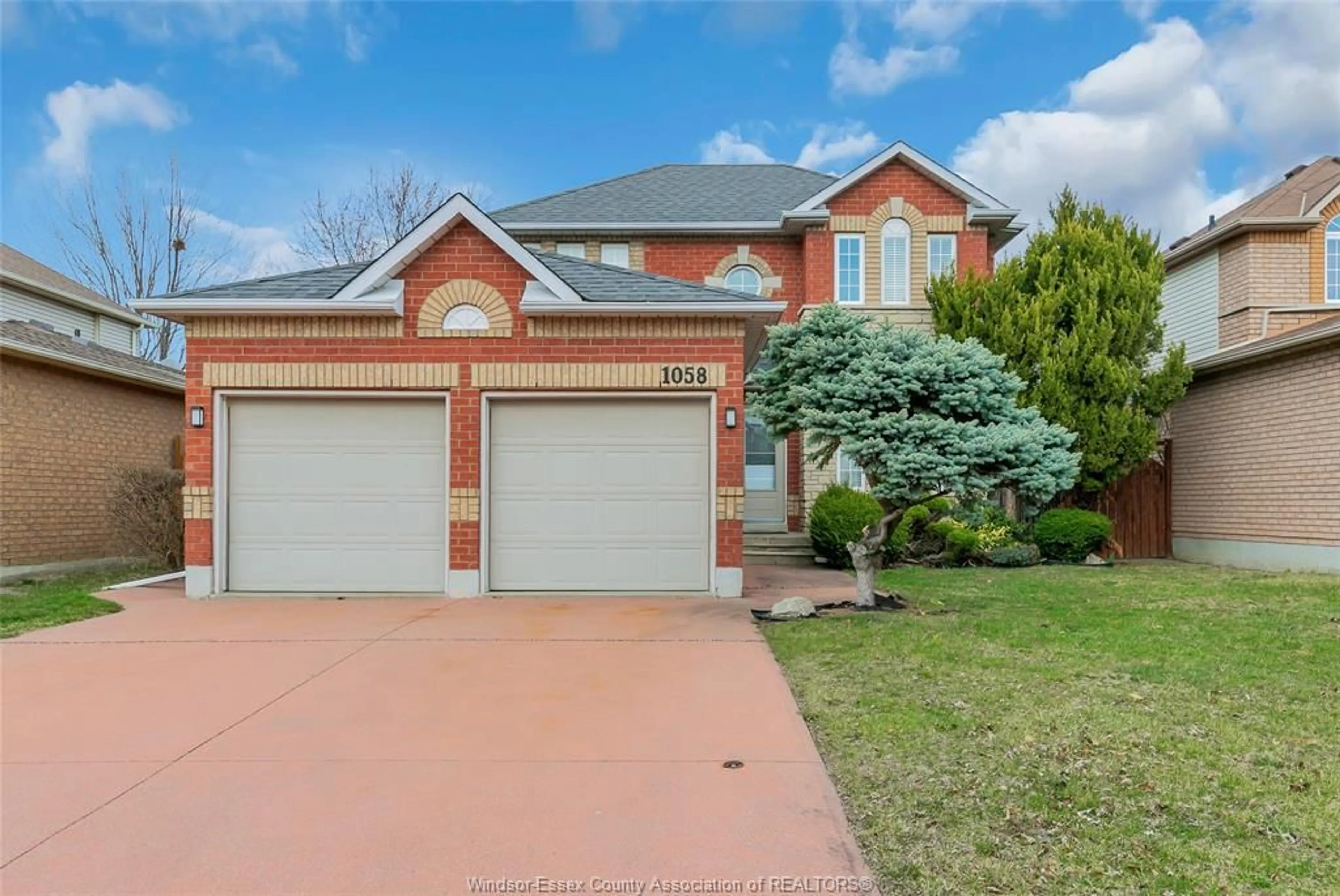Home with brick exterior material, street for 1058 PEACH BLOSSOM Cres, Windsor Ontario N9G 2R5