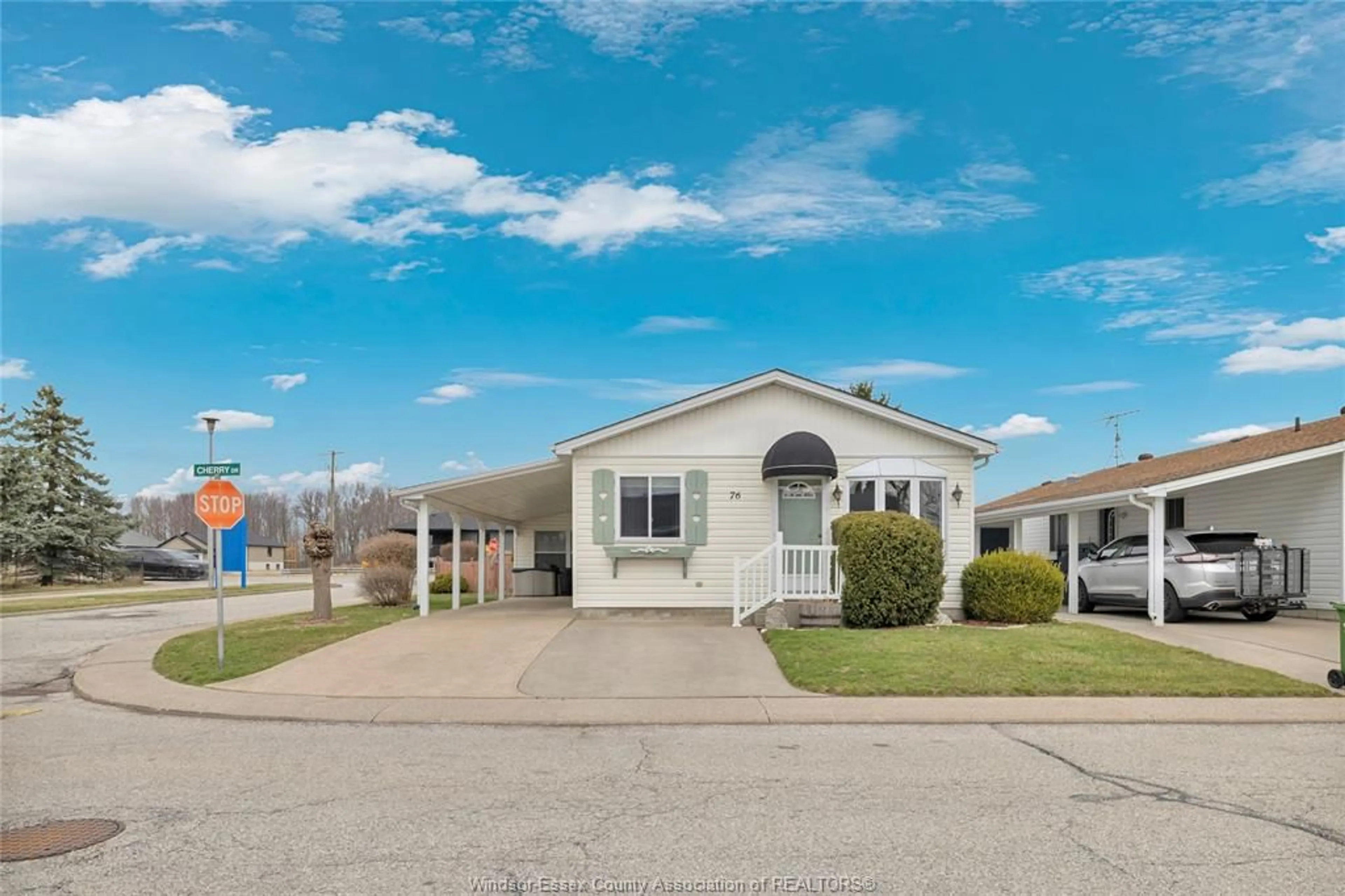 Home with vinyl exterior material, street for 76 CHERRY, McGregor Ontario N0R 1J0