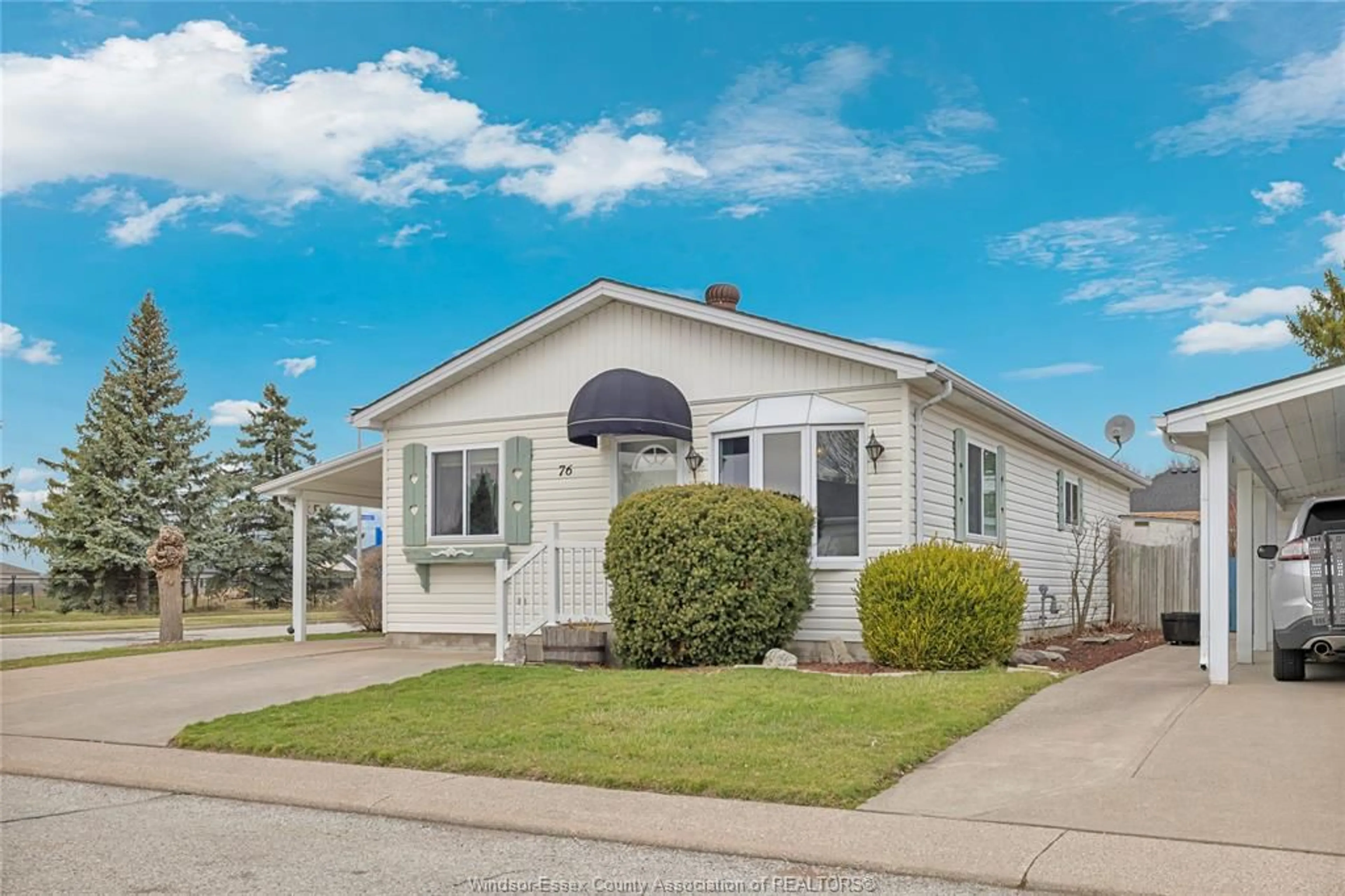 Home with vinyl exterior material, street for 76 CHERRY, McGregor Ontario N0R 1J0