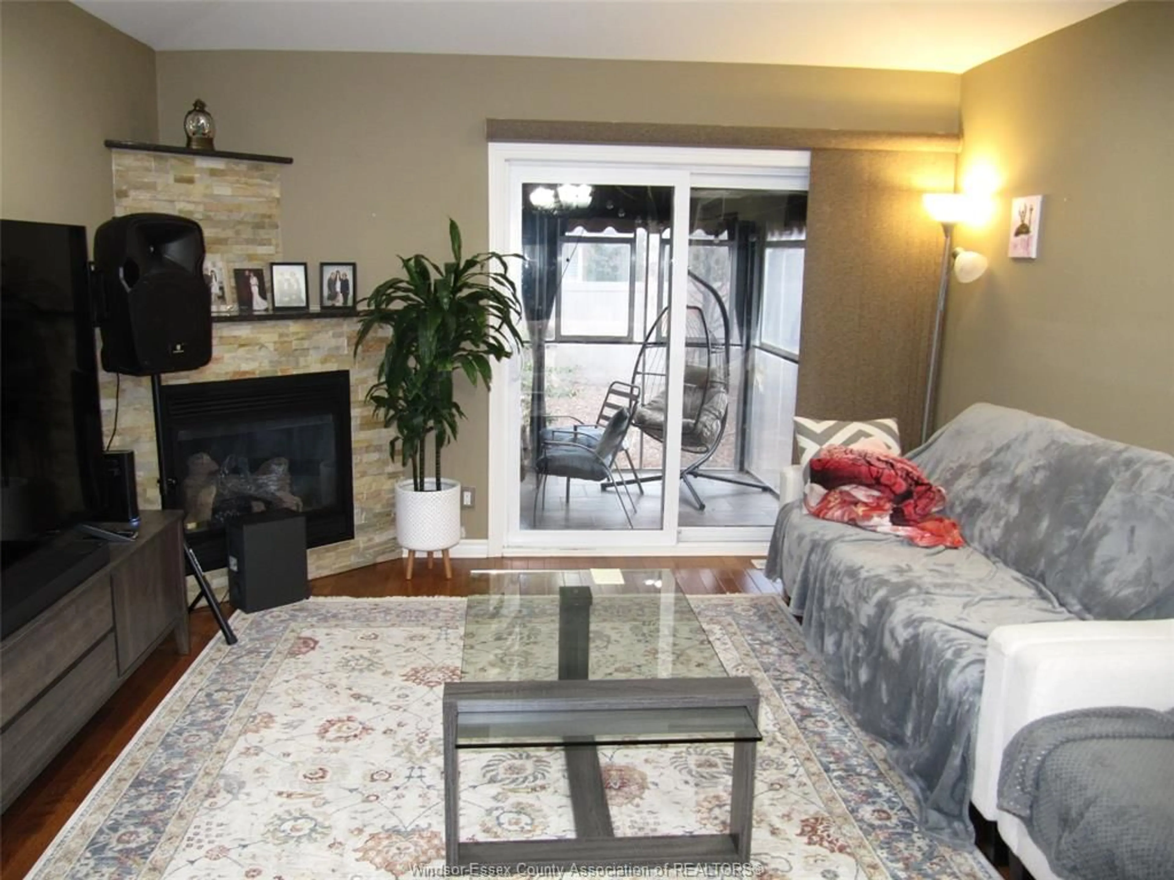 Living room with furniture, wood/laminate floor for 3218 Seville, Windsor Ontario N8N 0A4
