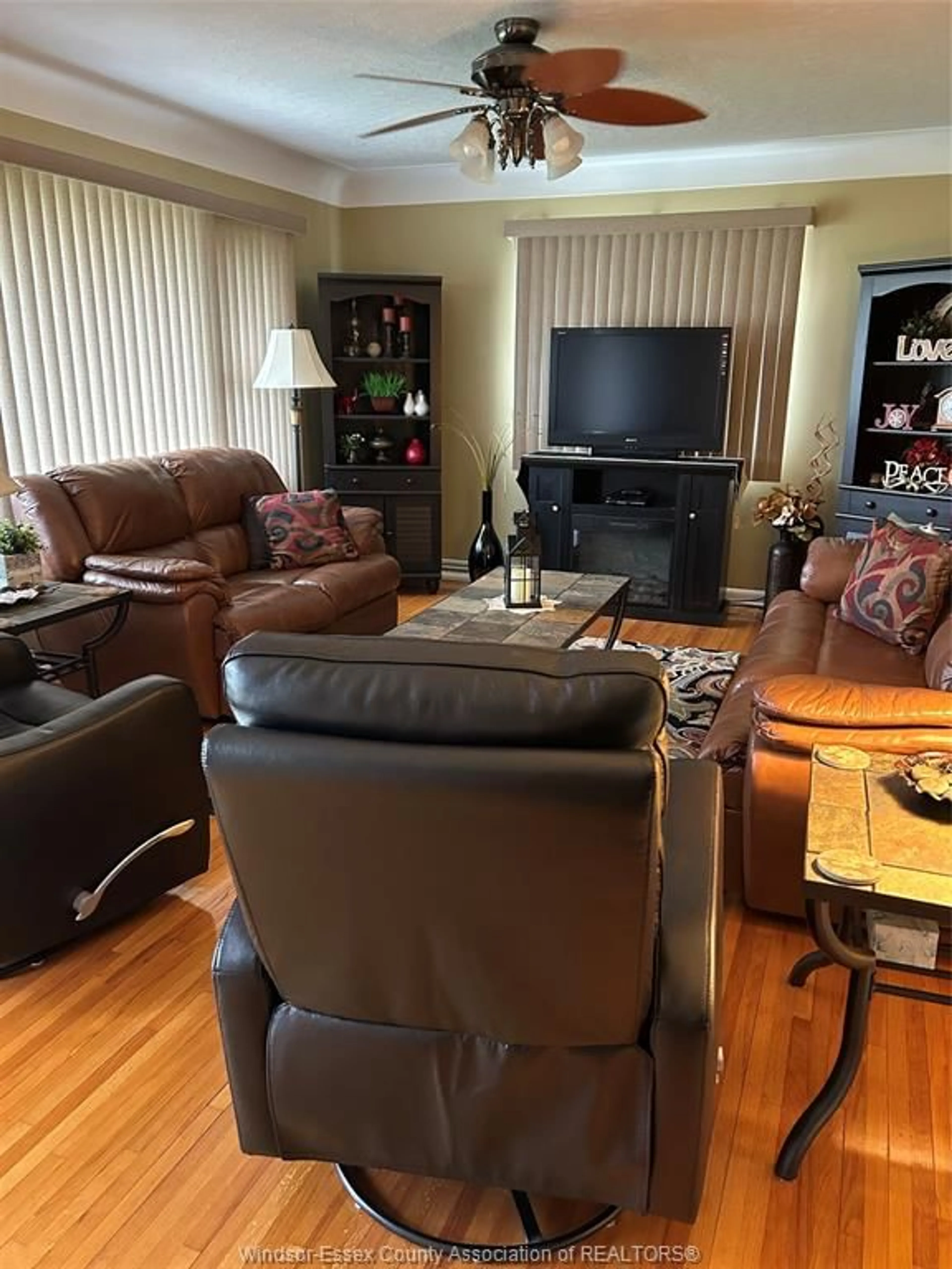 Living room with furniture, wood/laminate floor for 448 COUNTY RD 34, Kingsville Ontario N8M 2X5