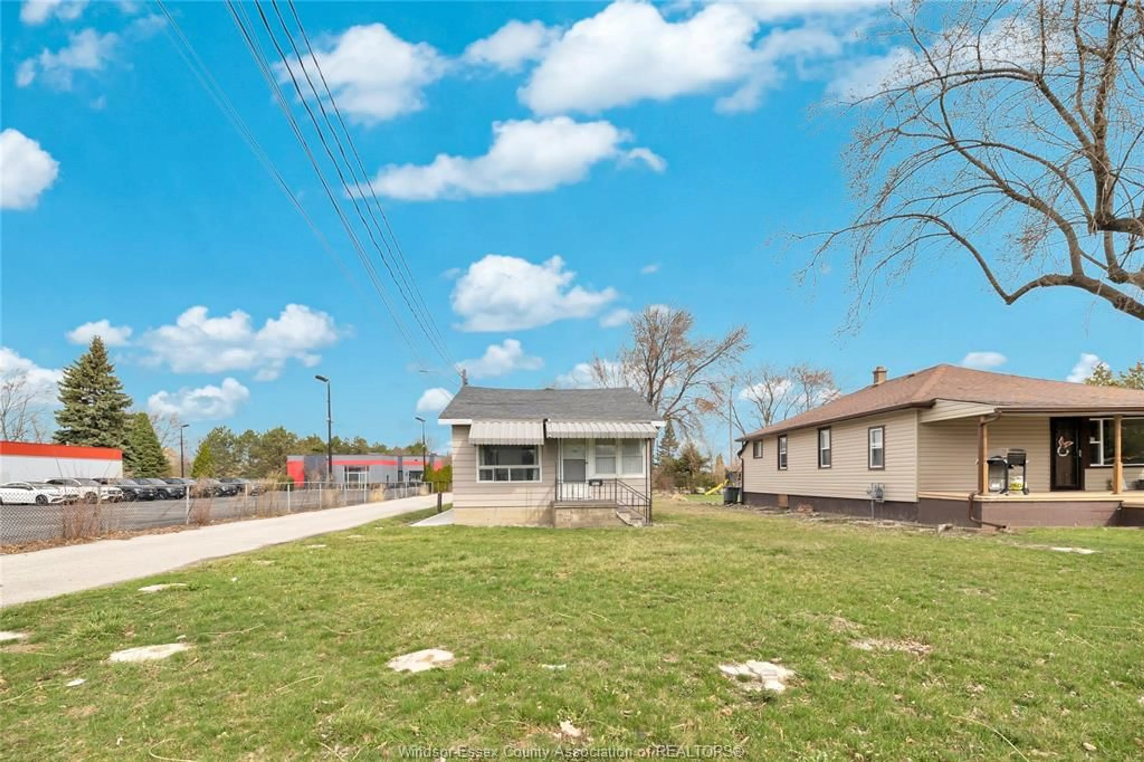 A pic from outside/outdoor area/front of a property/back of a property/a pic from drone, street for 9572 TECUMSEH Rd, Windsor Ontario N8R 1A2