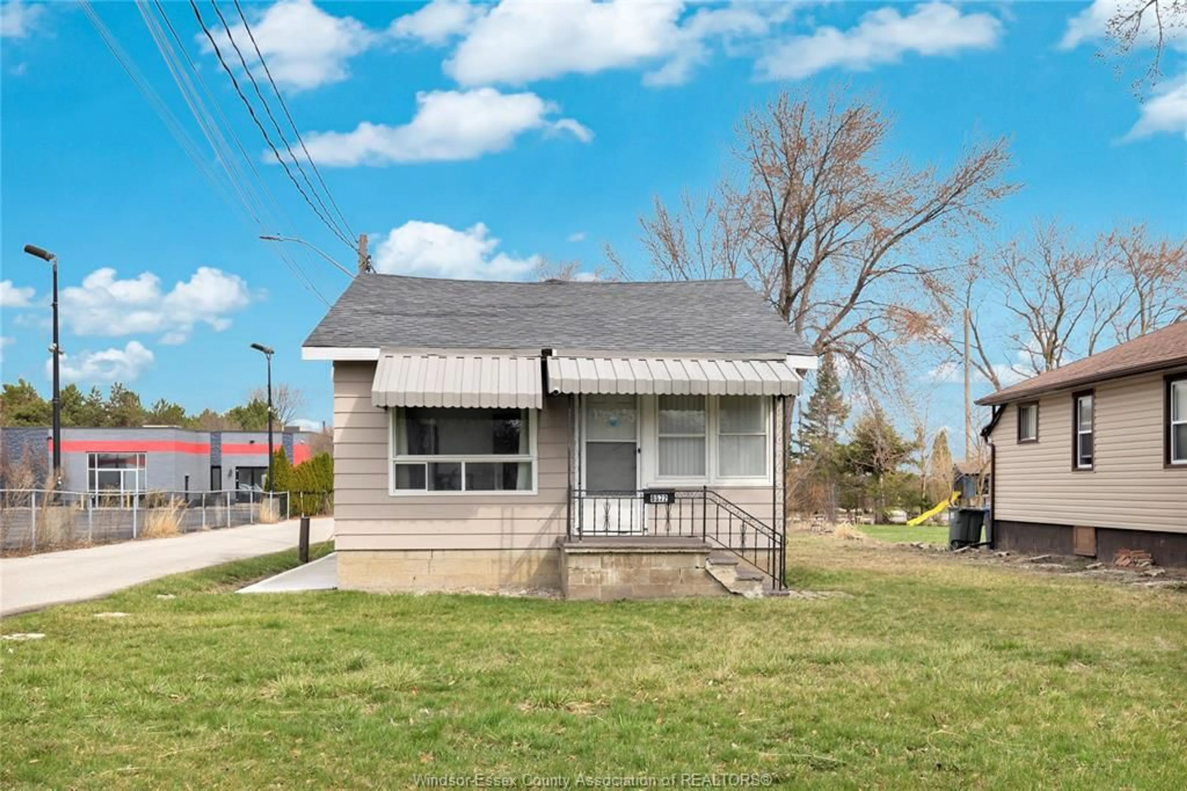 Home with vinyl exterior material, street for 9572 TECUMSEH Rd, Windsor Ontario N8R 1A2