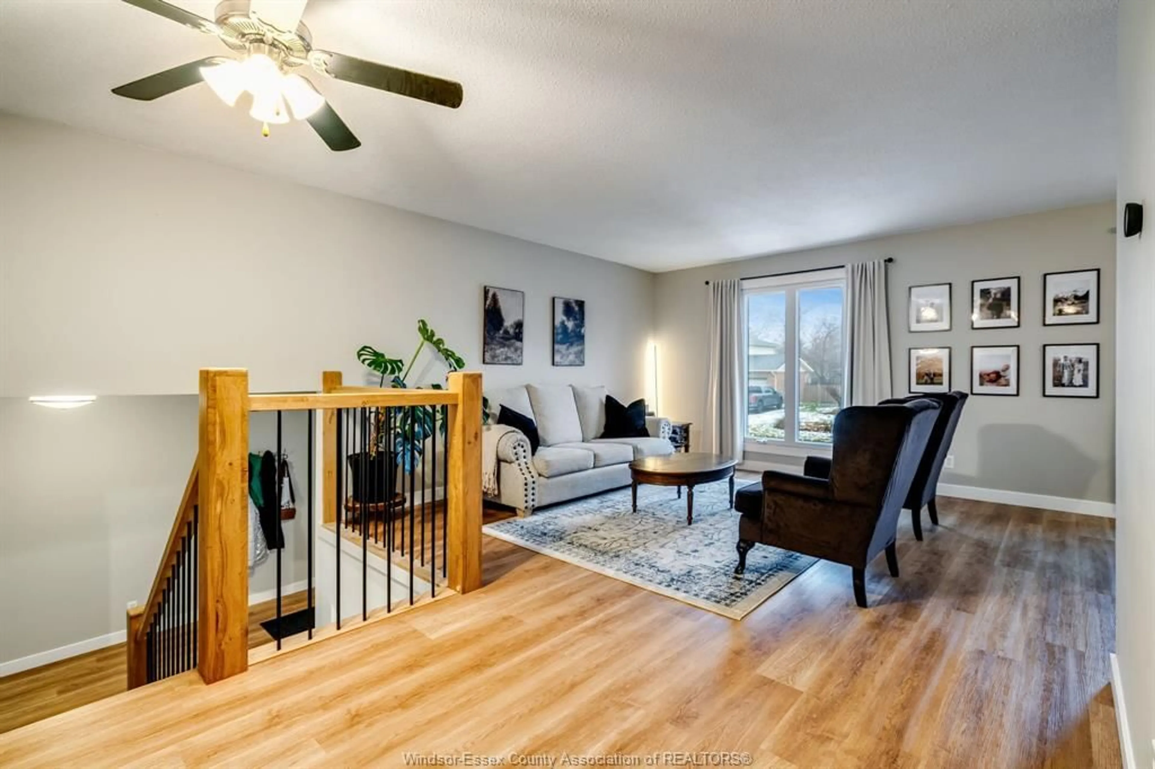 Living room with furniture, wood/laminate floor for 250 Applewood Rd, Kingsville Ontario N9Y 3P3