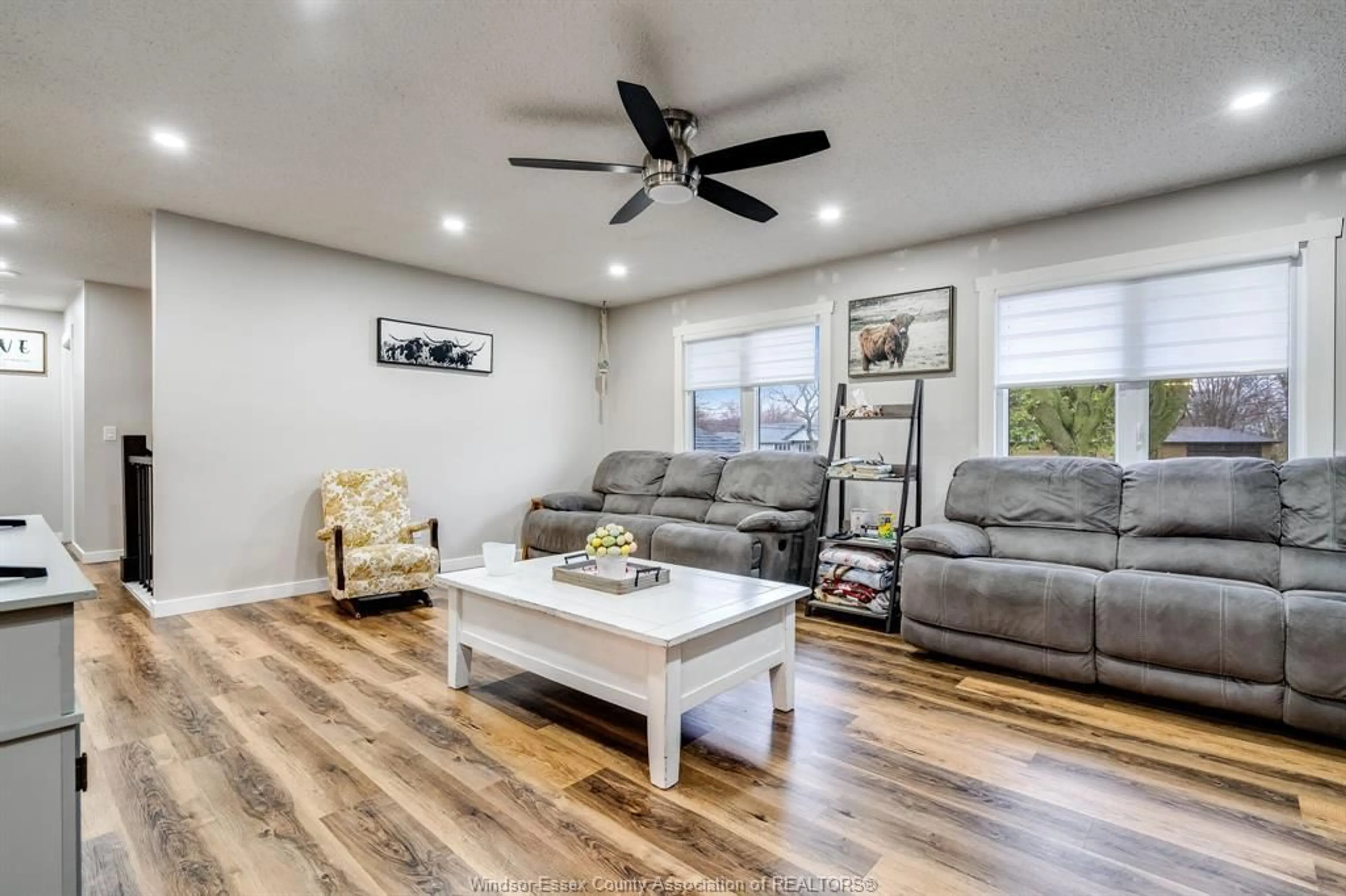 Living room with furniture, wood/laminate floor for 338 Erie St, Wheatley Ontario N0P 2P0