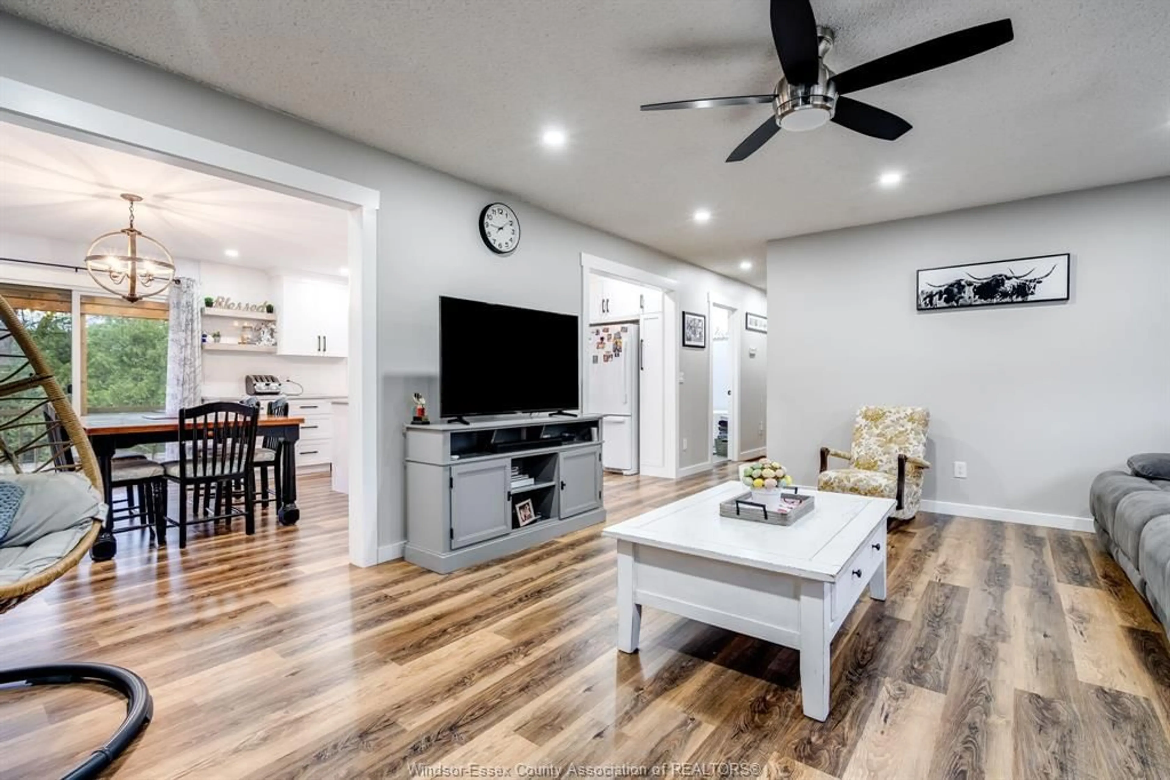 Living room with furniture, wood/laminate floor for 338 Erie St, Wheatley Ontario N0P 2P0