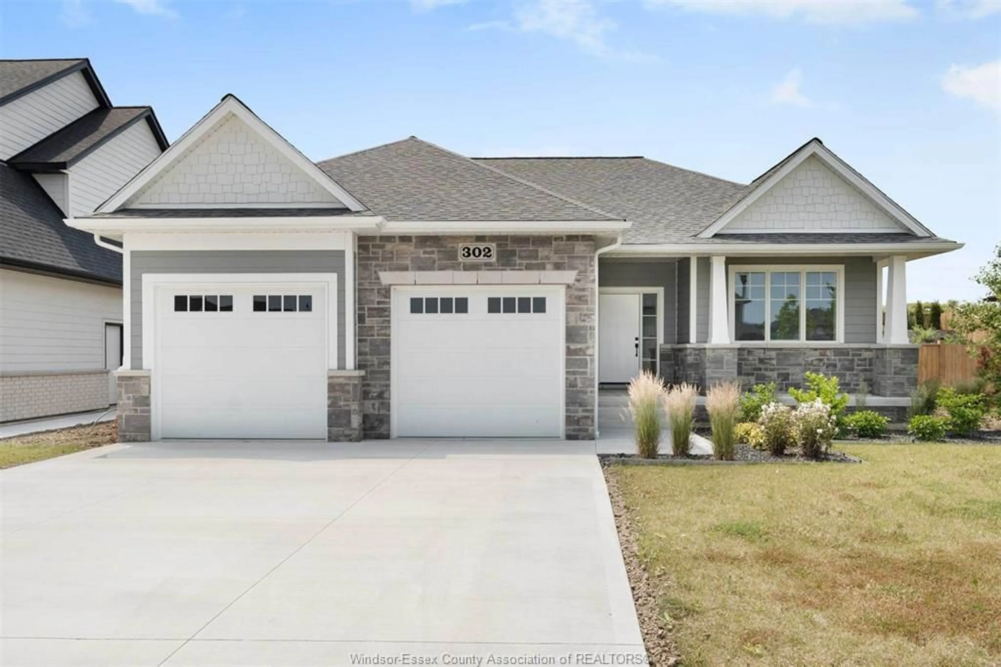 Home with brick exterior material, street for 302 BLAKE Ave, Belle River Ontario N0R 1A0