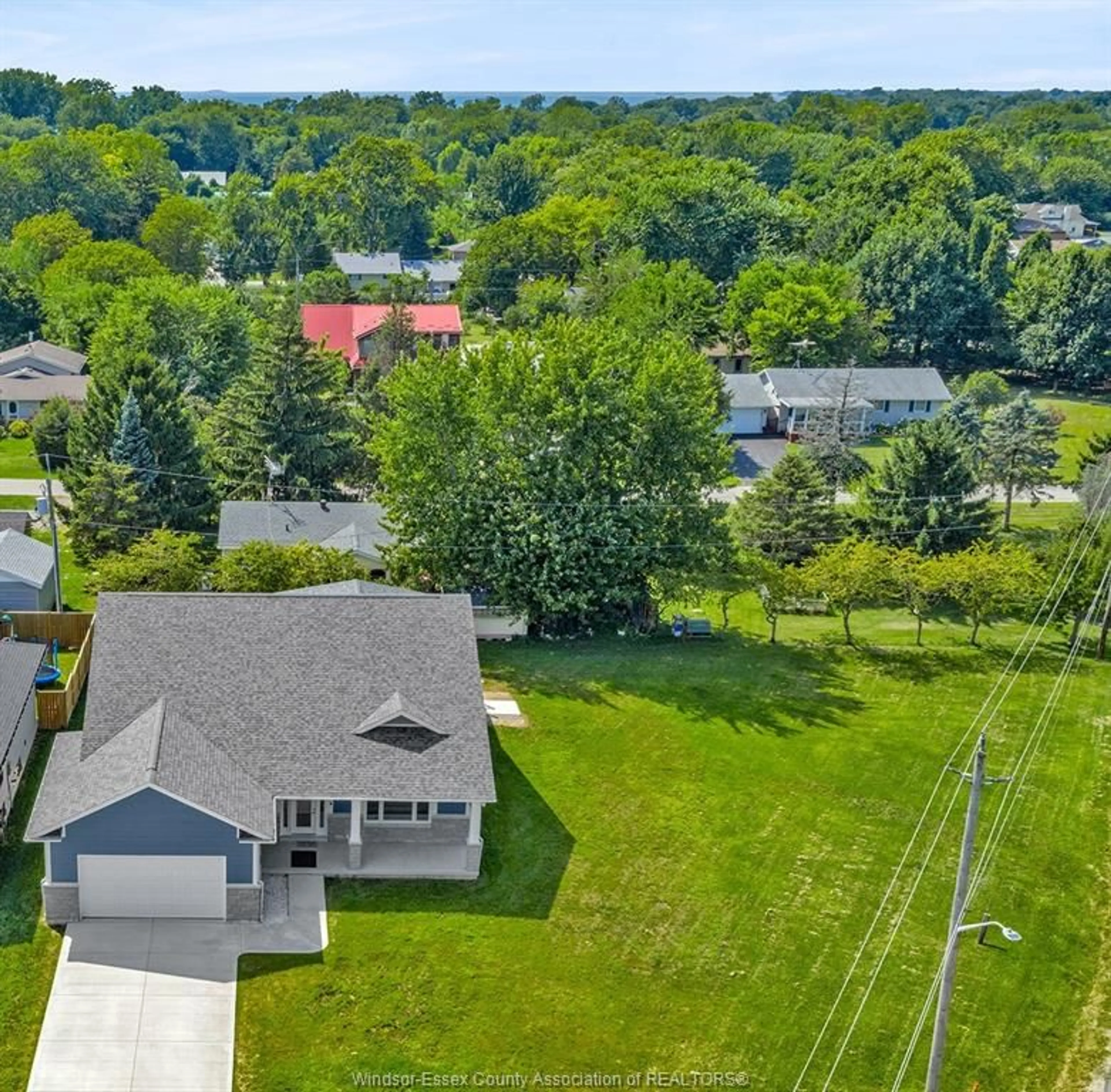 A pic from outside/outdoor area/front of a property/back of a property/a pic from drone, unknown for 157 GLOUCESTER Dr, Essex Ontario N0R 1G0