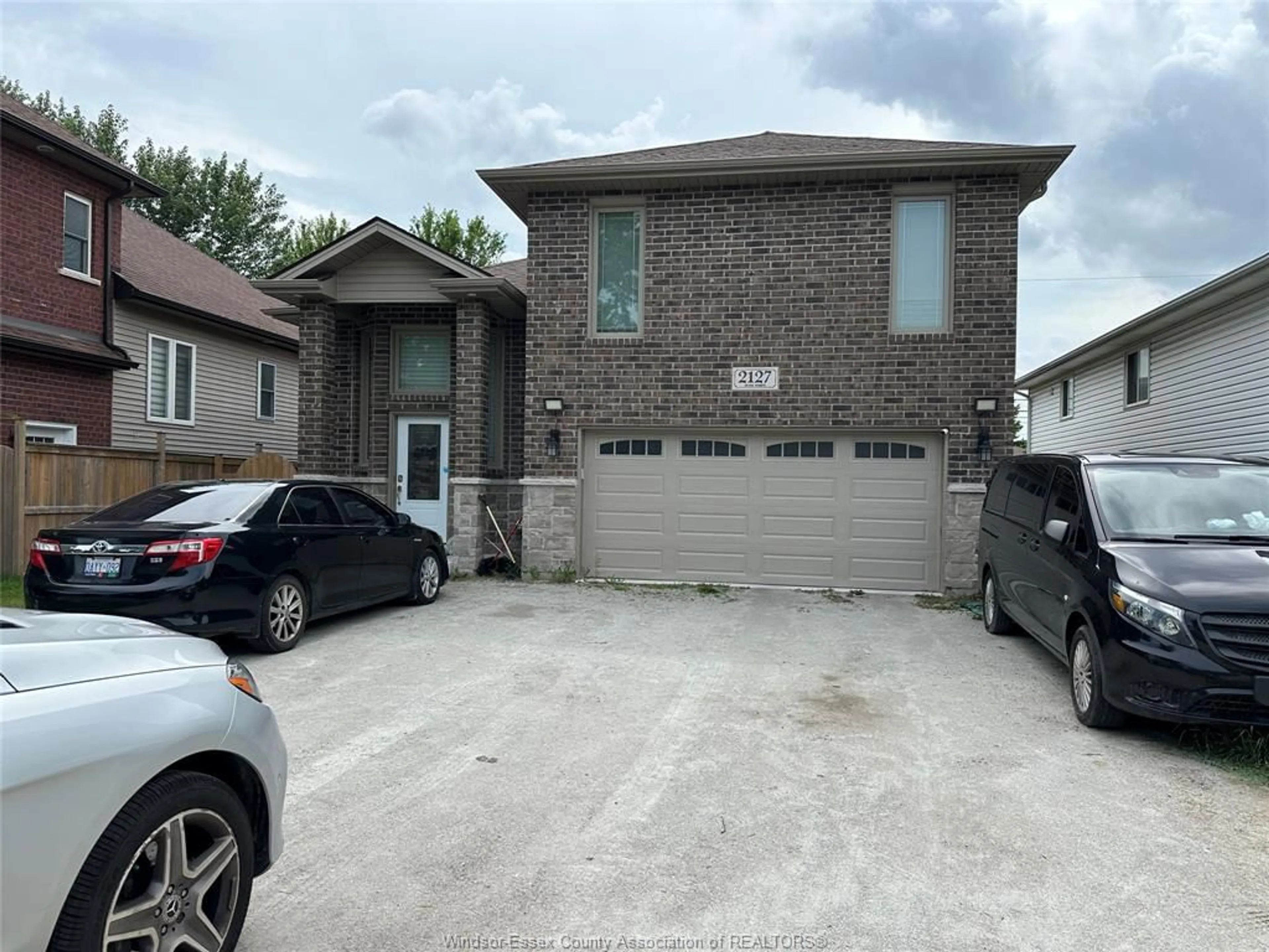 Home with brick exterior material, street for 2127 DOMINION Blvd, Windsor Ontario N9B 3H8