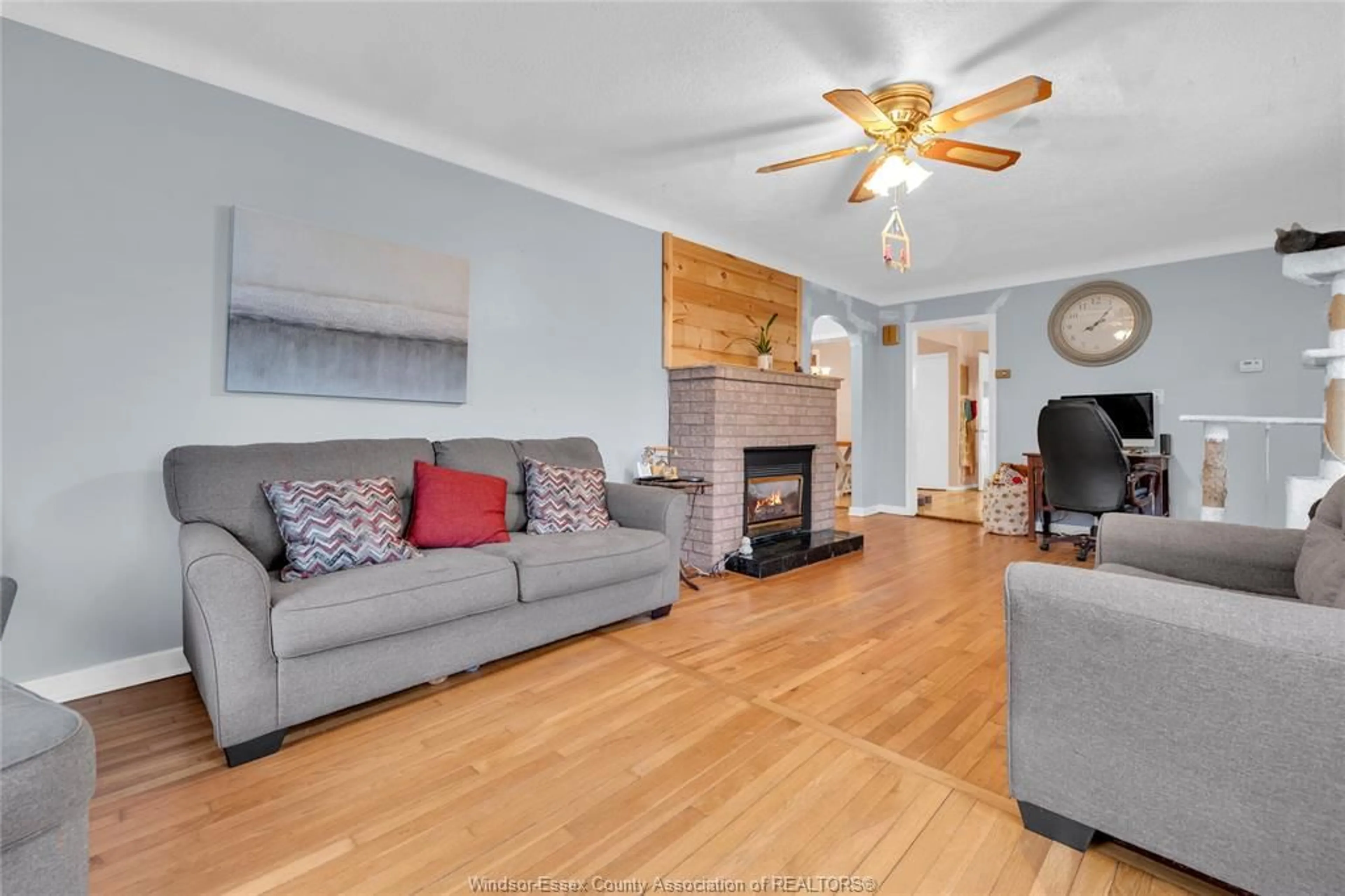 Living room with furniture, wood/laminate floor for 12288 TALBOT Rd, Tecumseh Ontario N0R 1K0