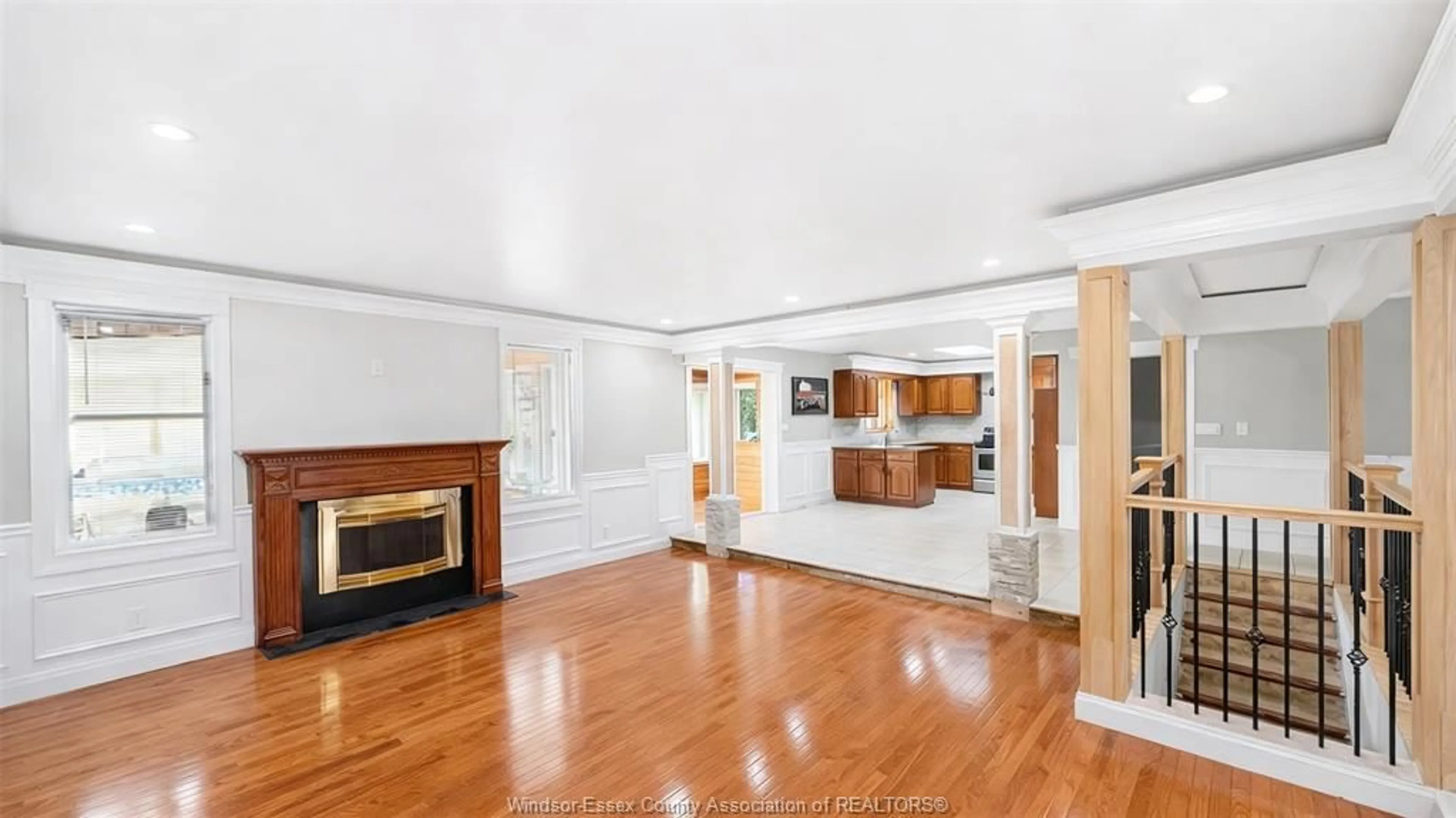 Living room with furniture, wood/laminate floor for 4585 HOWARD Ave, Windsor Ontario N9G 1P6