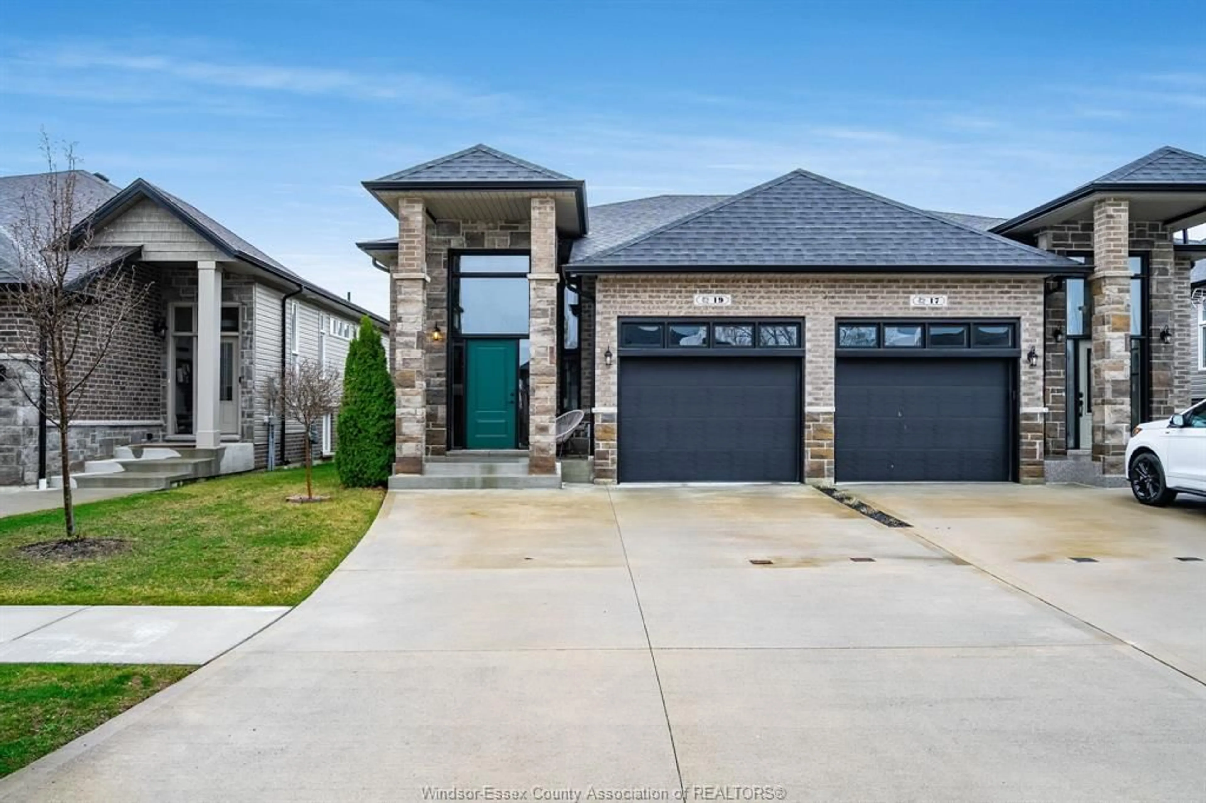 Home with brick exterior material, street for 19 Woodland, Kingsville Ontario N9Y 1A0