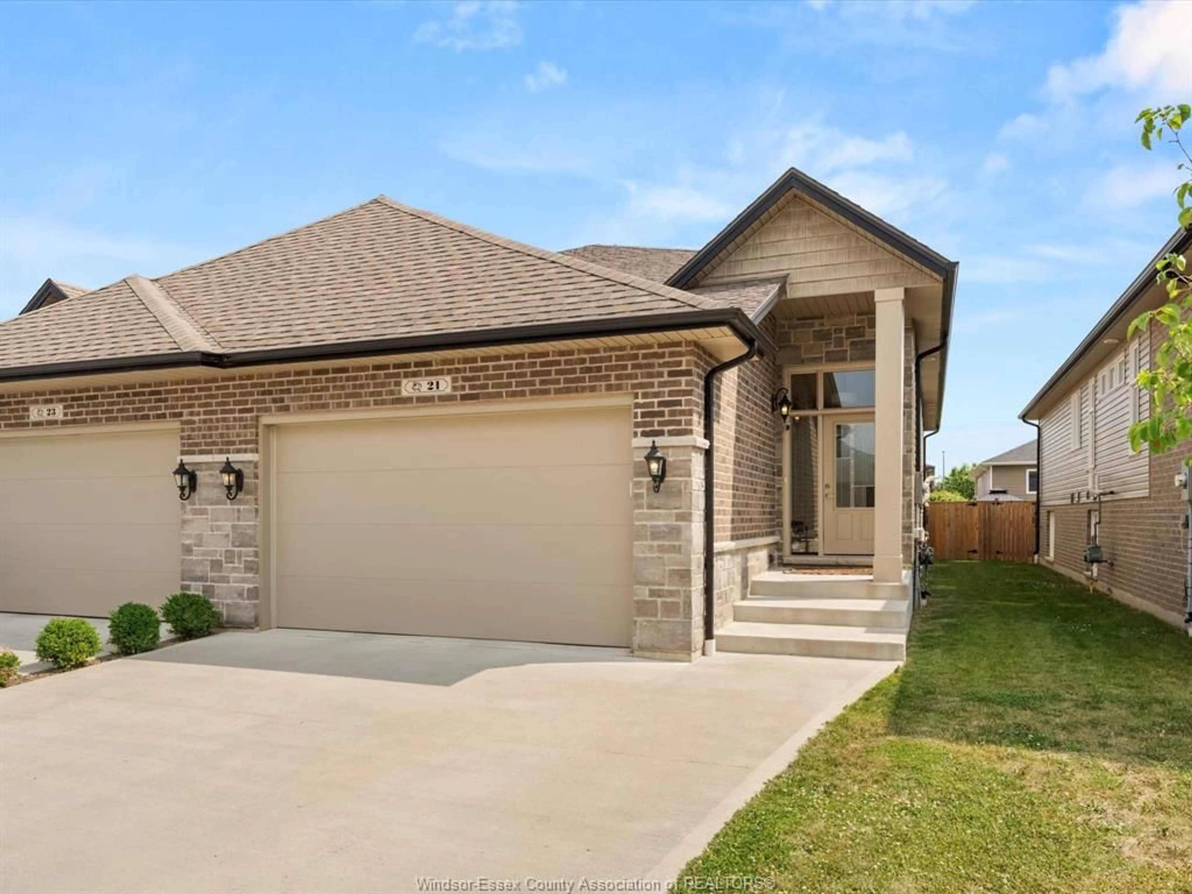 Home with brick exterior material, street for 21 WOODLAND St, Kingsville Ontario N9Y 0A9