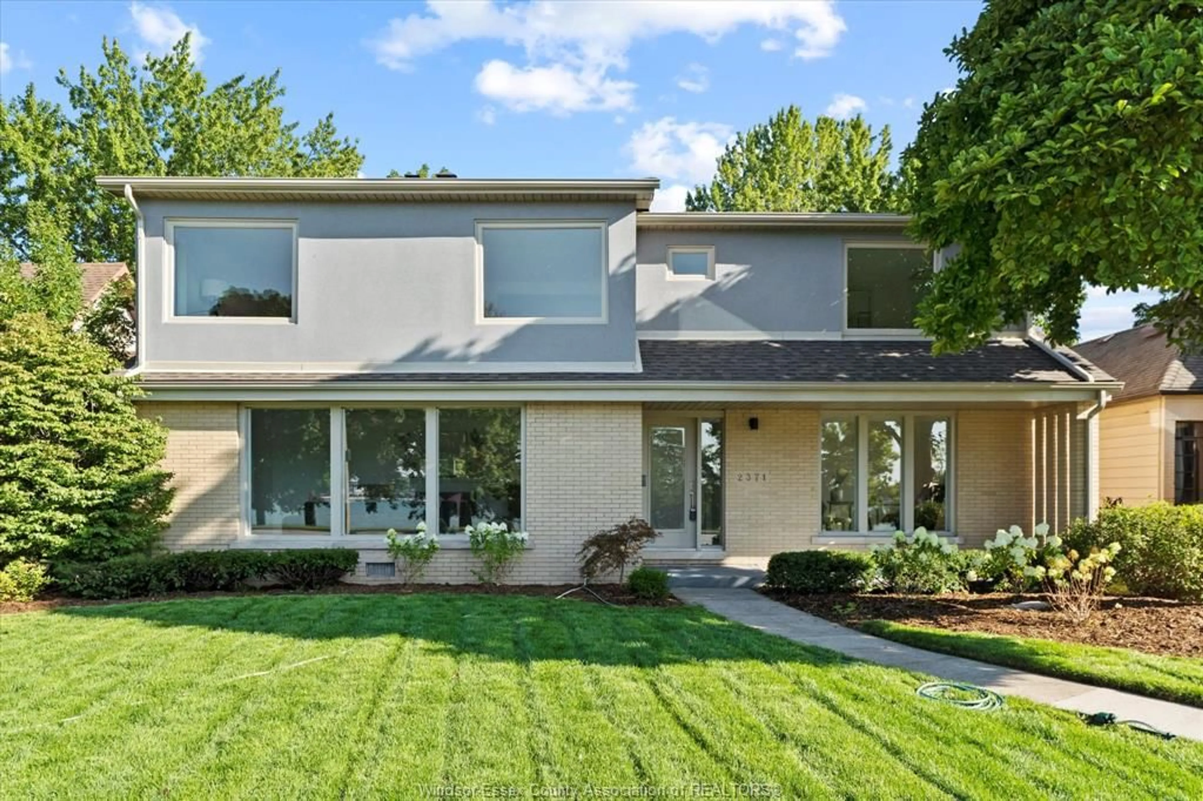 Home with vinyl exterior material, street for 2371 RIVERSIDE Dr, Windsor Ontario N9B 1B1