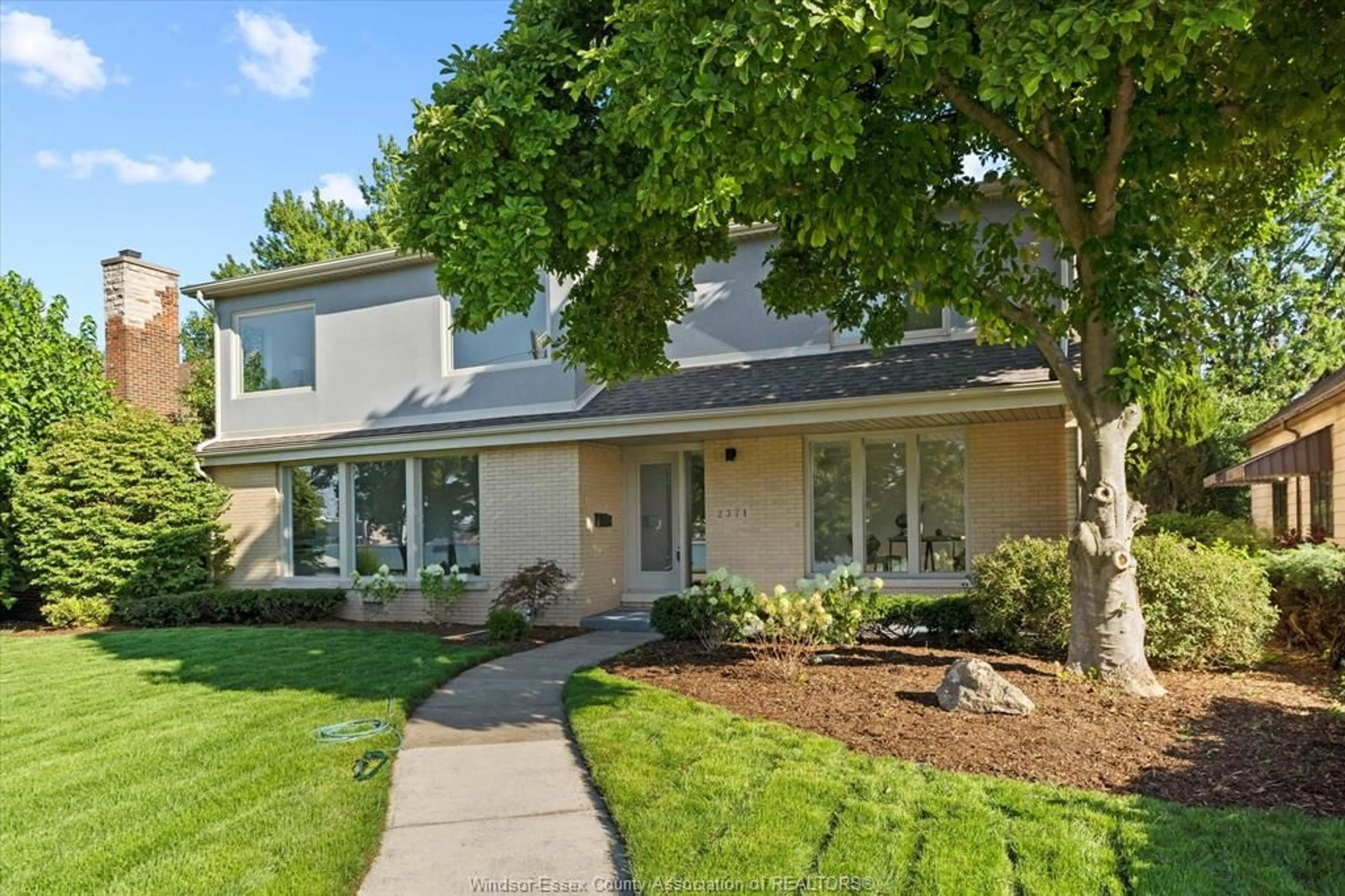 Home with vinyl exterior material, street for 2371 RIVERSIDE Dr, Windsor Ontario N9B 1B1