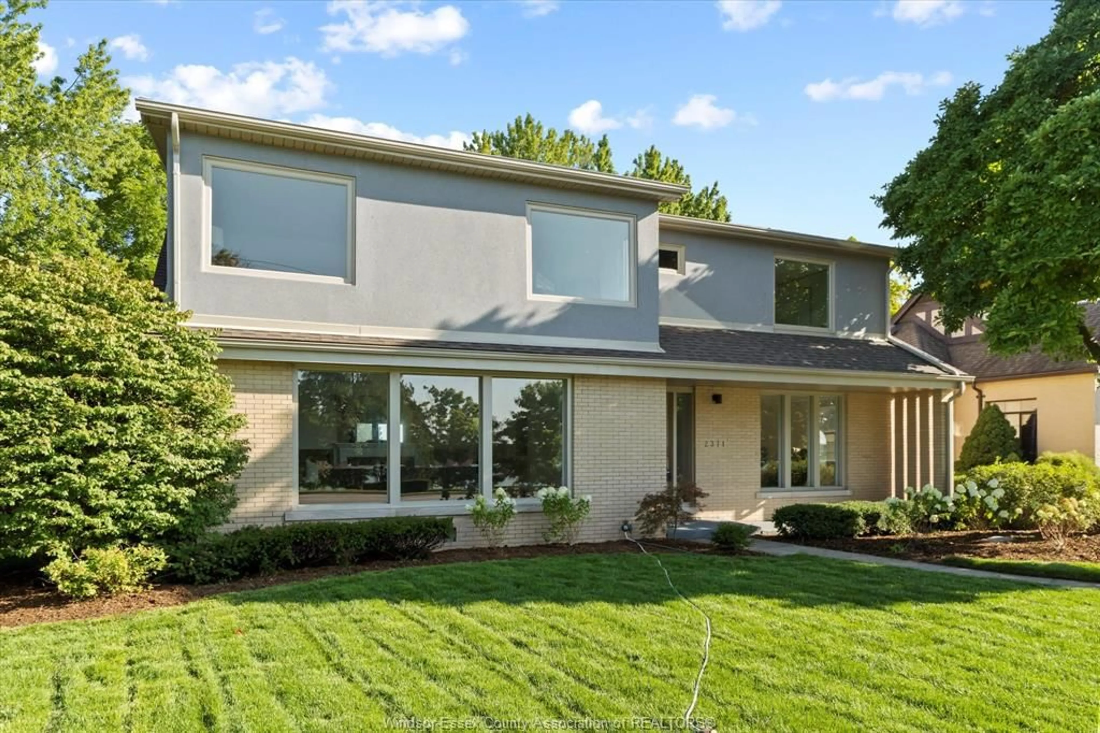 Home with brick exterior material, street for 2371 RIVERSIDE Dr, Windsor Ontario N9B 1B1