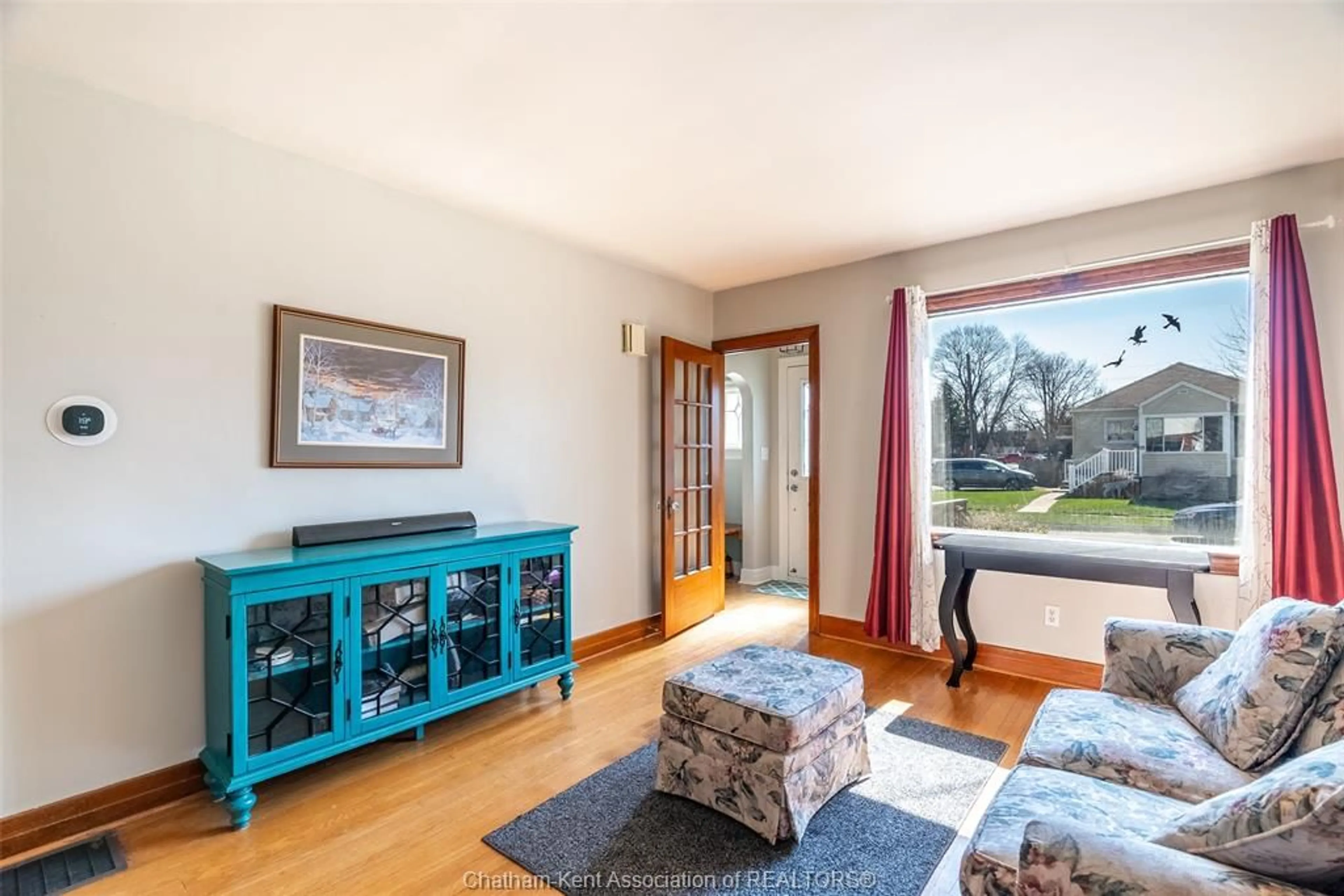 Living room with furniture, wood/laminate floor for 59 Prince Arthur Ave, Chatham Ontario N7M 1X5