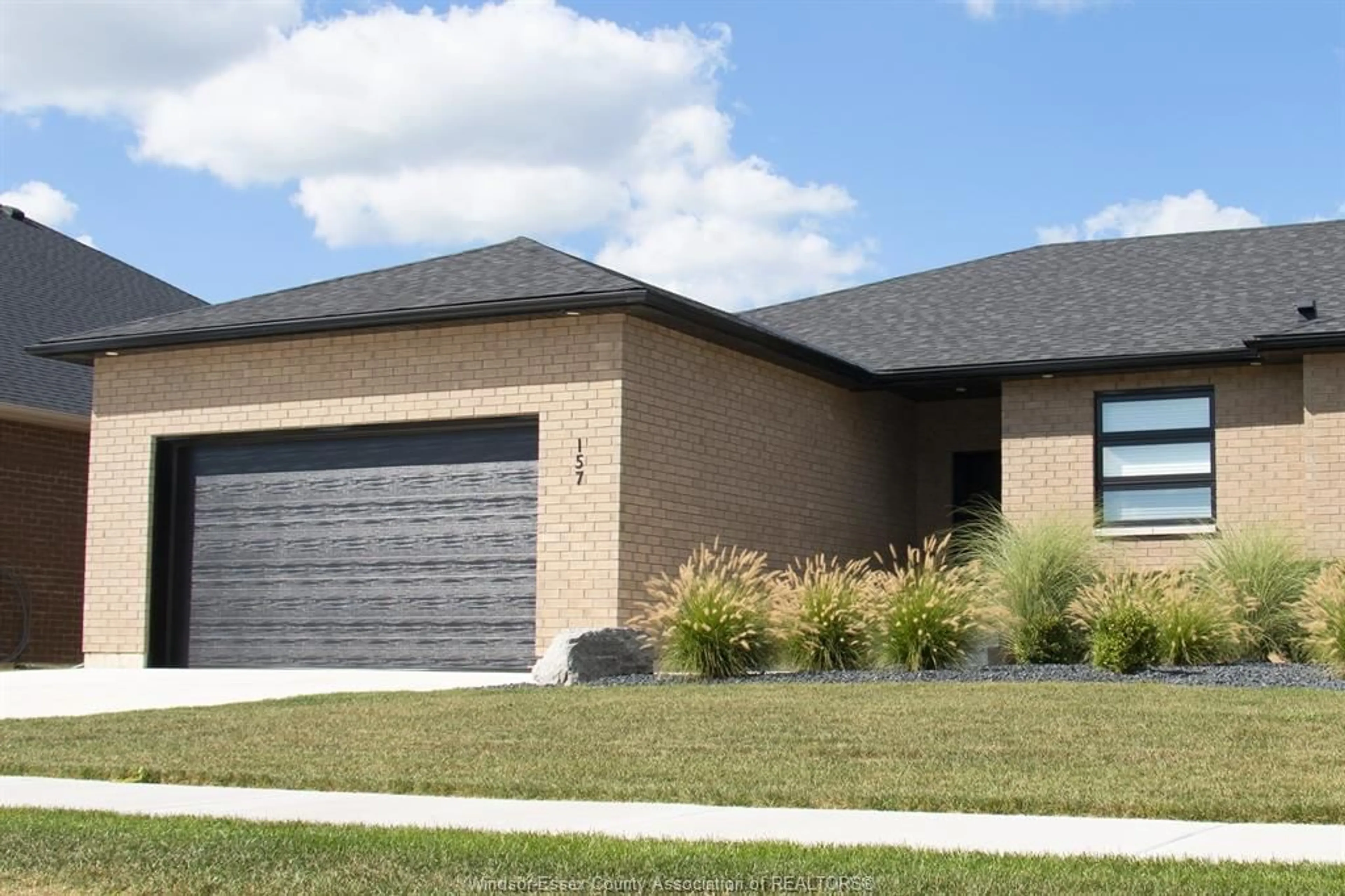 Home with brick exterior material, street for 157 BLUE JAY Cres, Kingsville Ontario N9Y 0E3