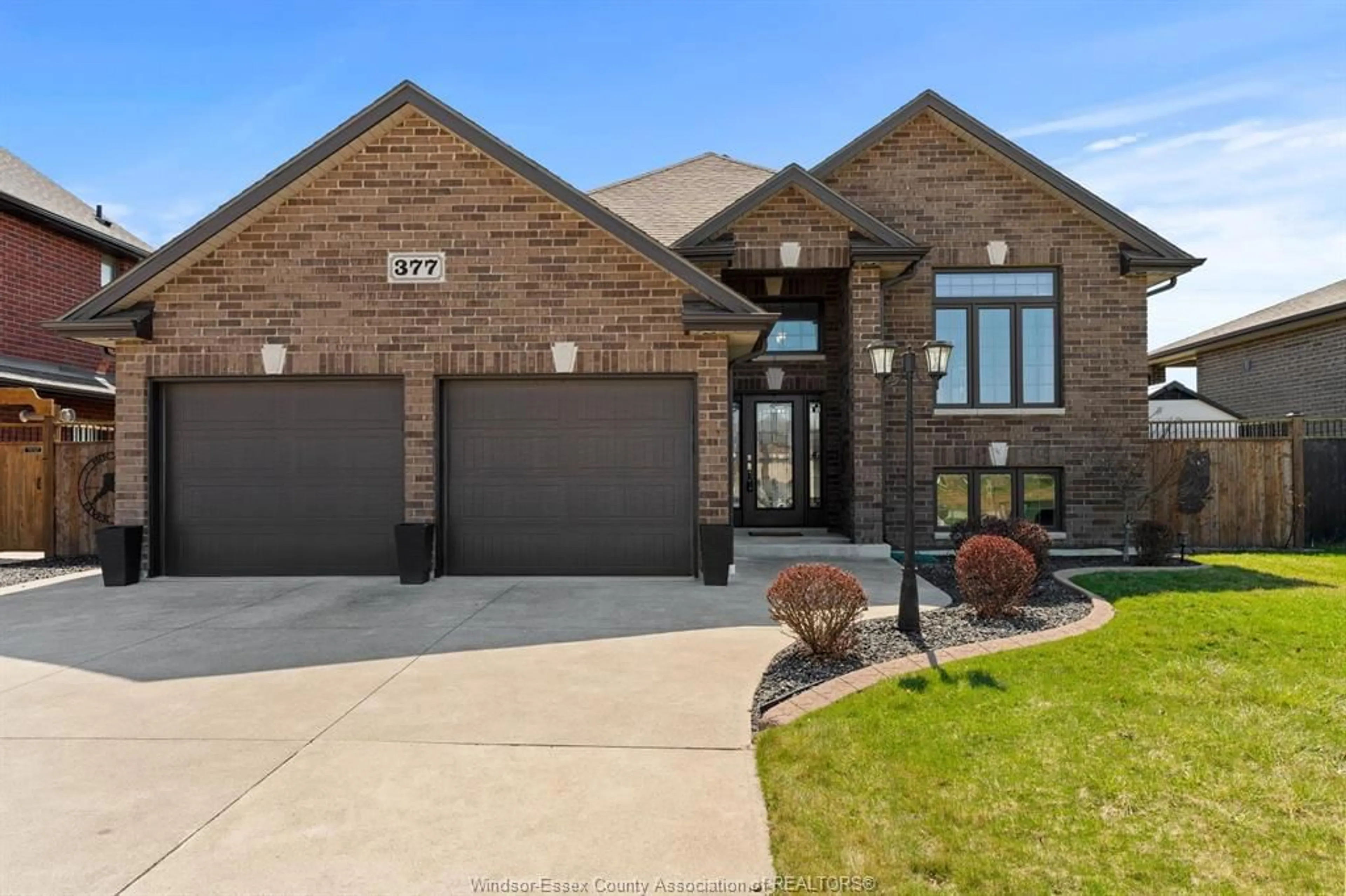 Home with brick exterior material, street for 377 PIROLI Cres, Lakeshore Ontario N0R 1A0