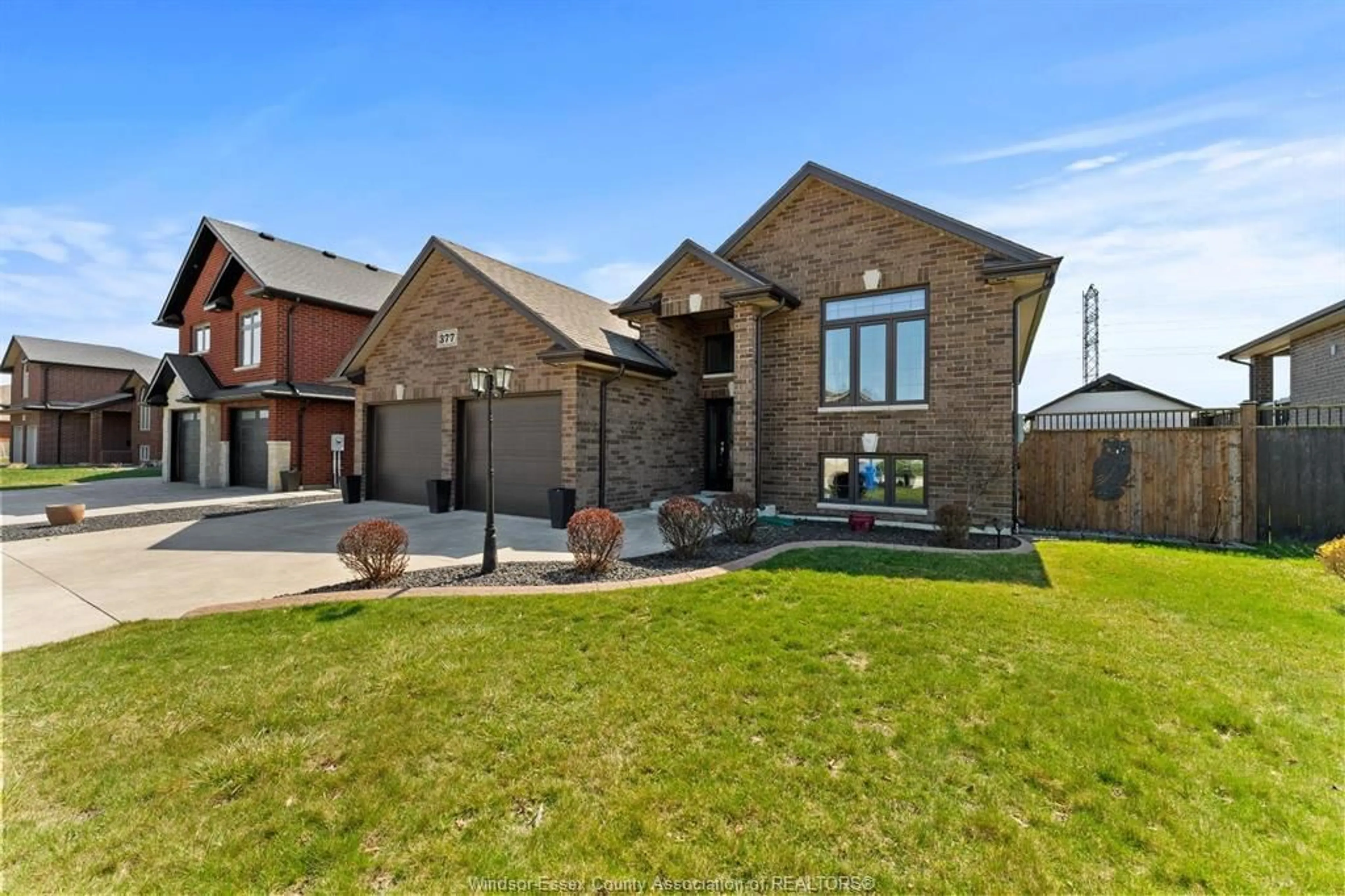 Home with brick exterior material, street for 377 PIROLI Cres, Lakeshore Ontario N0R 1A0