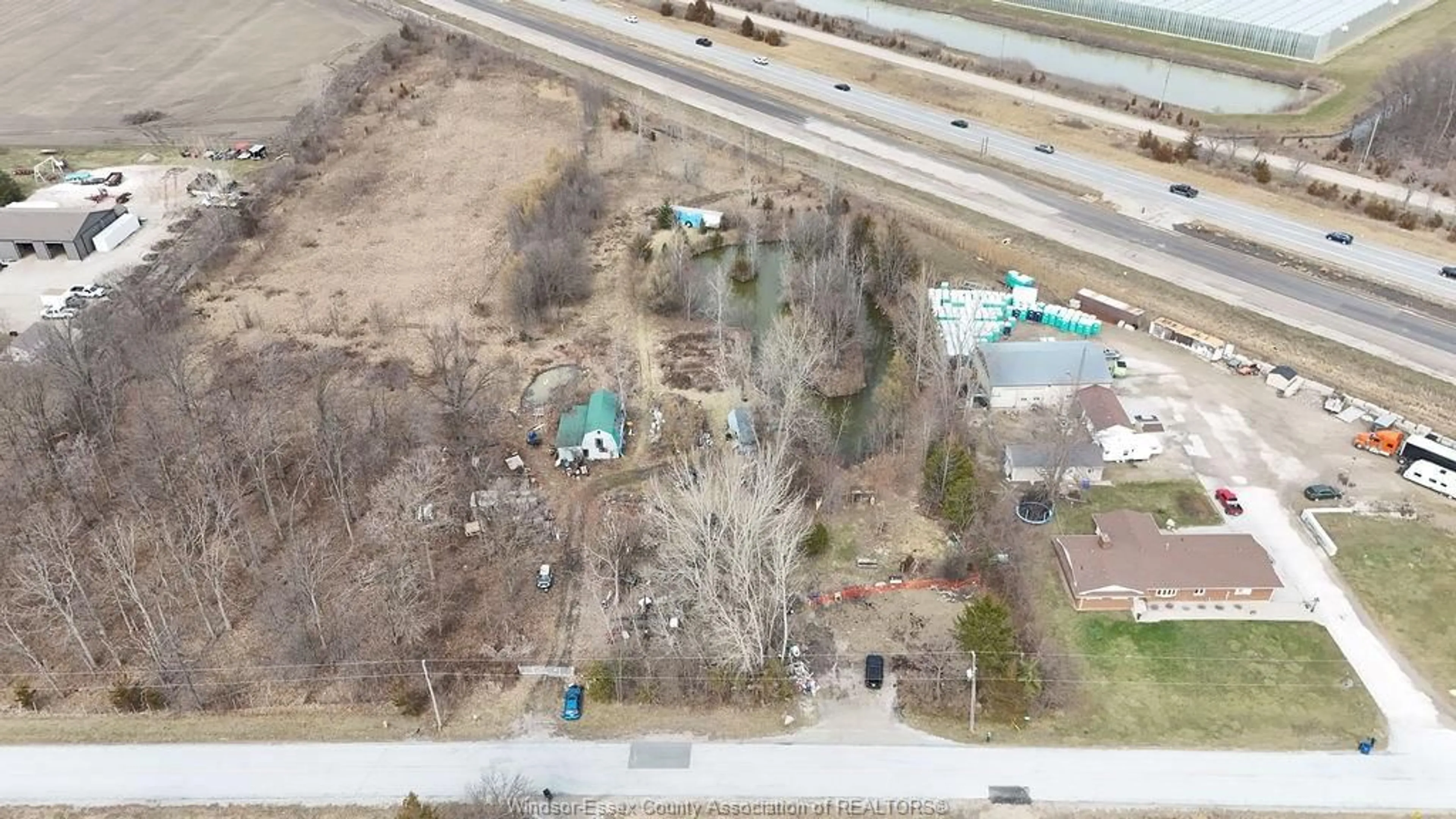 A pic from outside/outdoor area/front of a property/back of a property/a pic from drone, unknown for 100 ROAD 6, Kingsville Ontario N0R 1B0