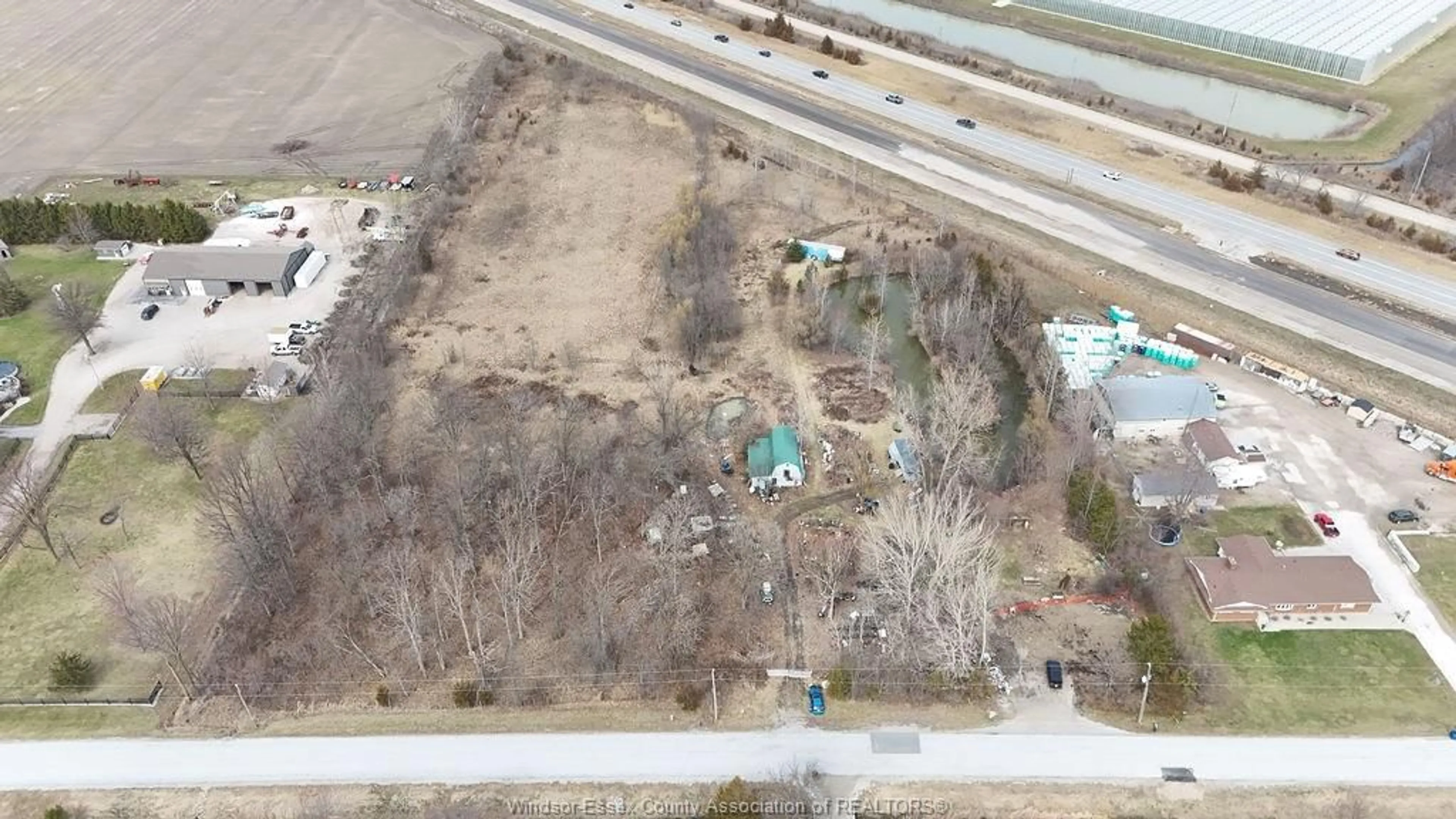 A pic from outside/outdoor area/front of a property/back of a property/a pic from drone, unknown for 100 ROAD 6, Kingsville Ontario N0R 1B0