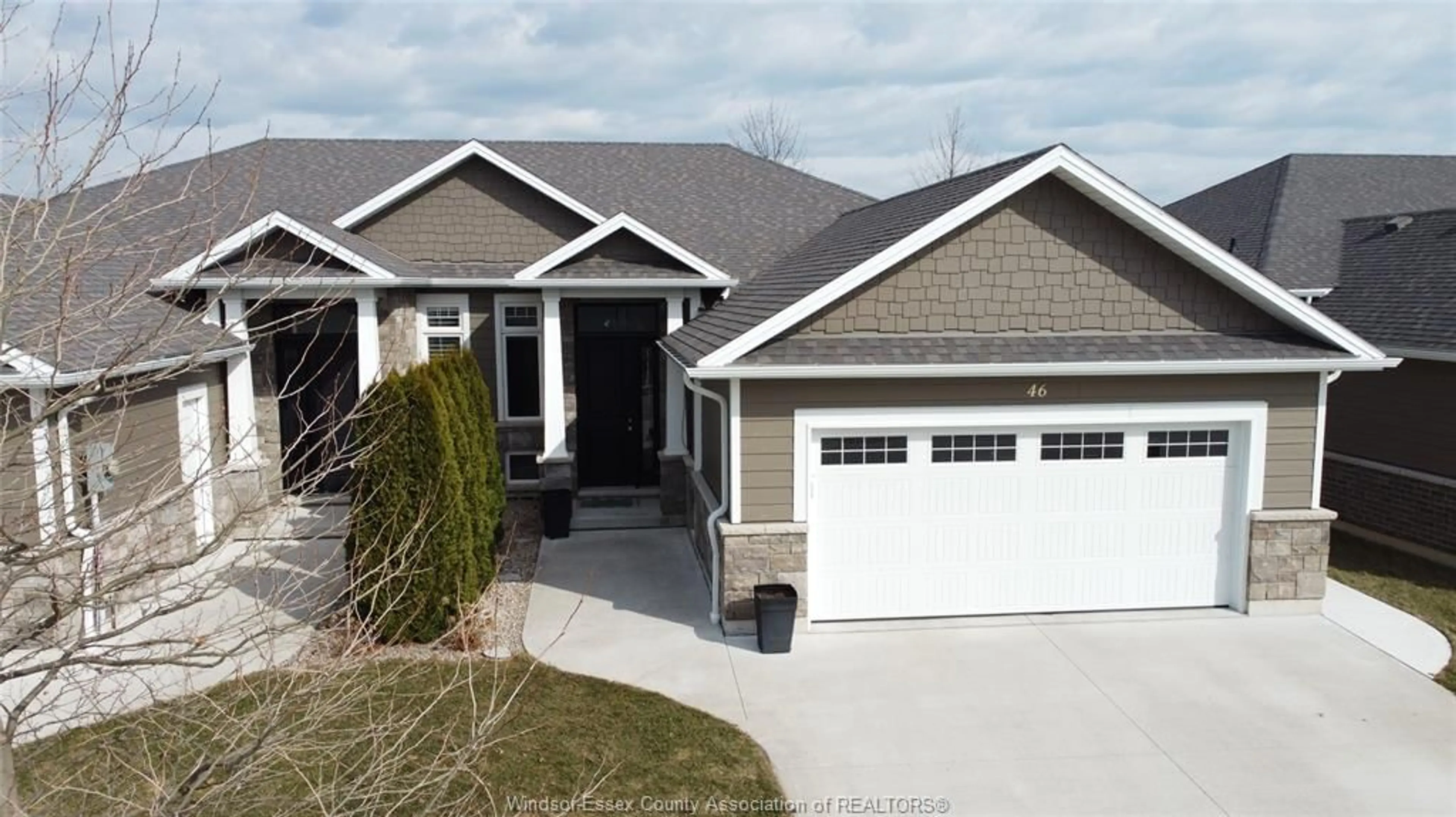 Home with vinyl exterior material, street for 46 DESTINY Dr, Leamington Ontario N8H 0E1
