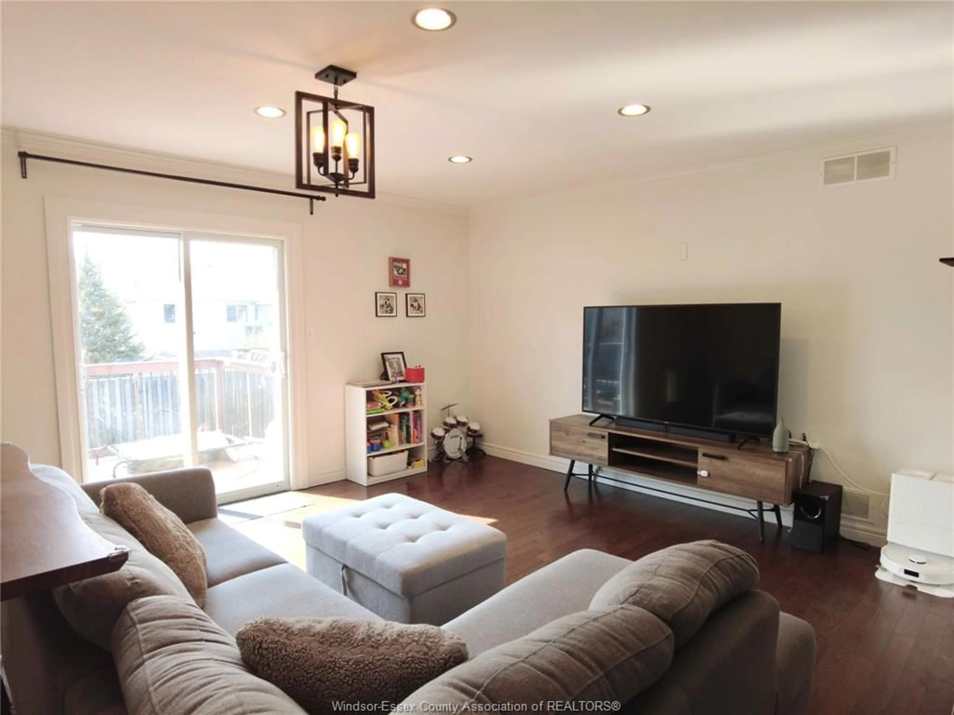 Living room with furniture, wood/laminate floor for 2437 LUXURY Ave, Windsor Ontario N8P 1S8