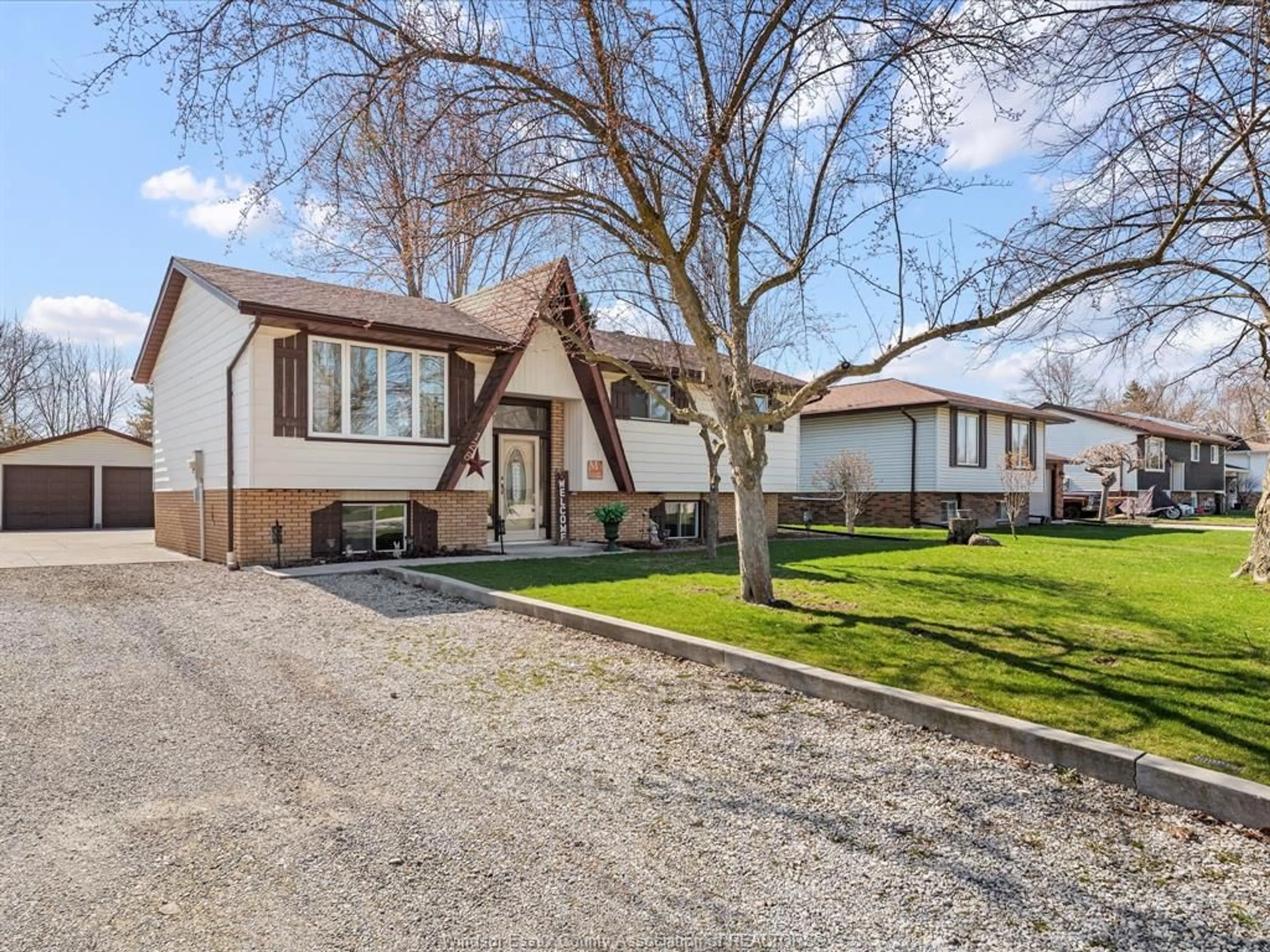 Home with vinyl exterior material, street for 128 Hill St, Cottam Ontario N0R 1B0