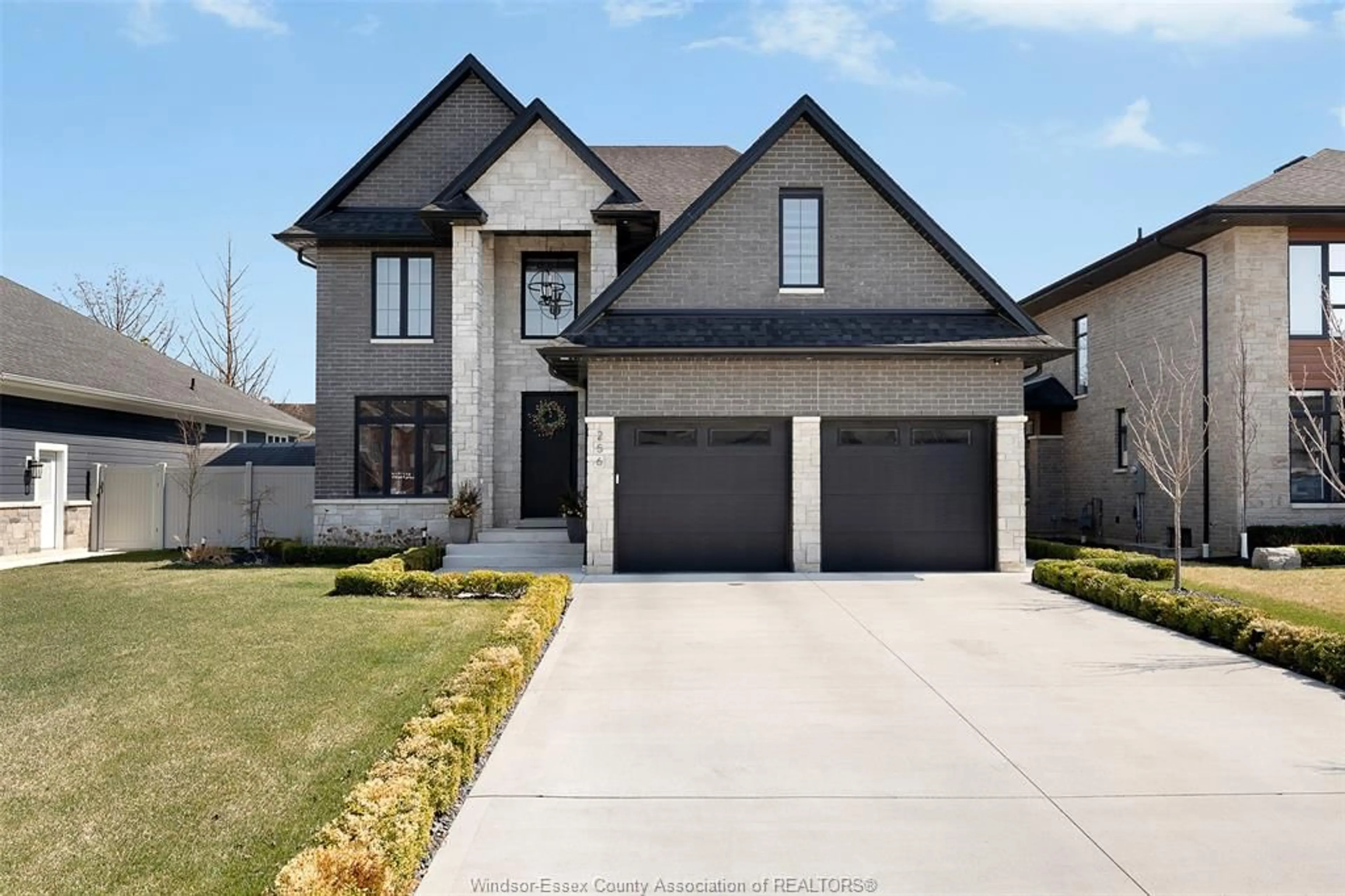 Home with brick exterior material, street for 256 XAVIER Cir, Lakeshore Ontario N0R 1A0