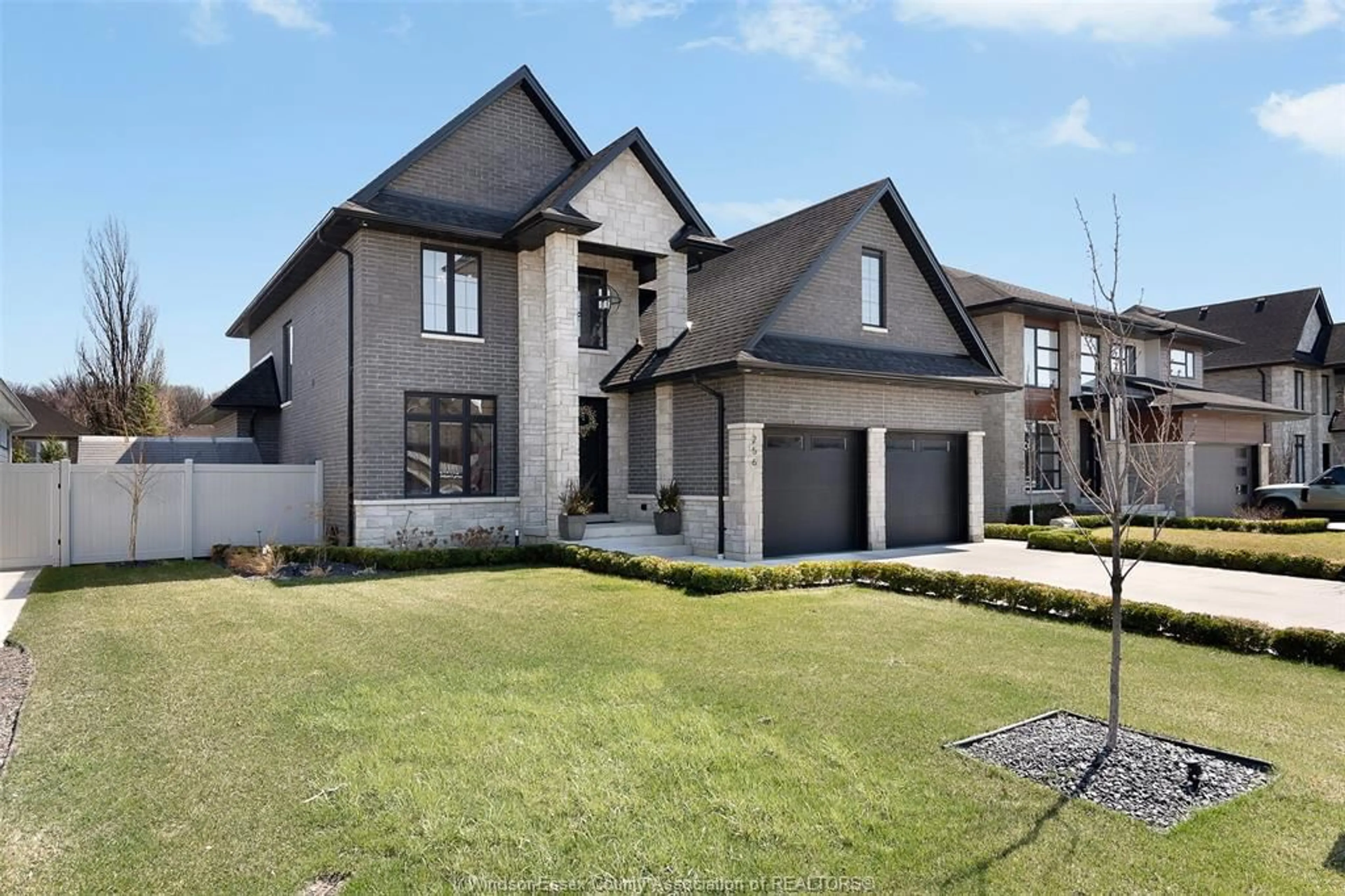 Home with brick exterior material, street for 256 XAVIER Cir, Lakeshore Ontario N0R 1A0