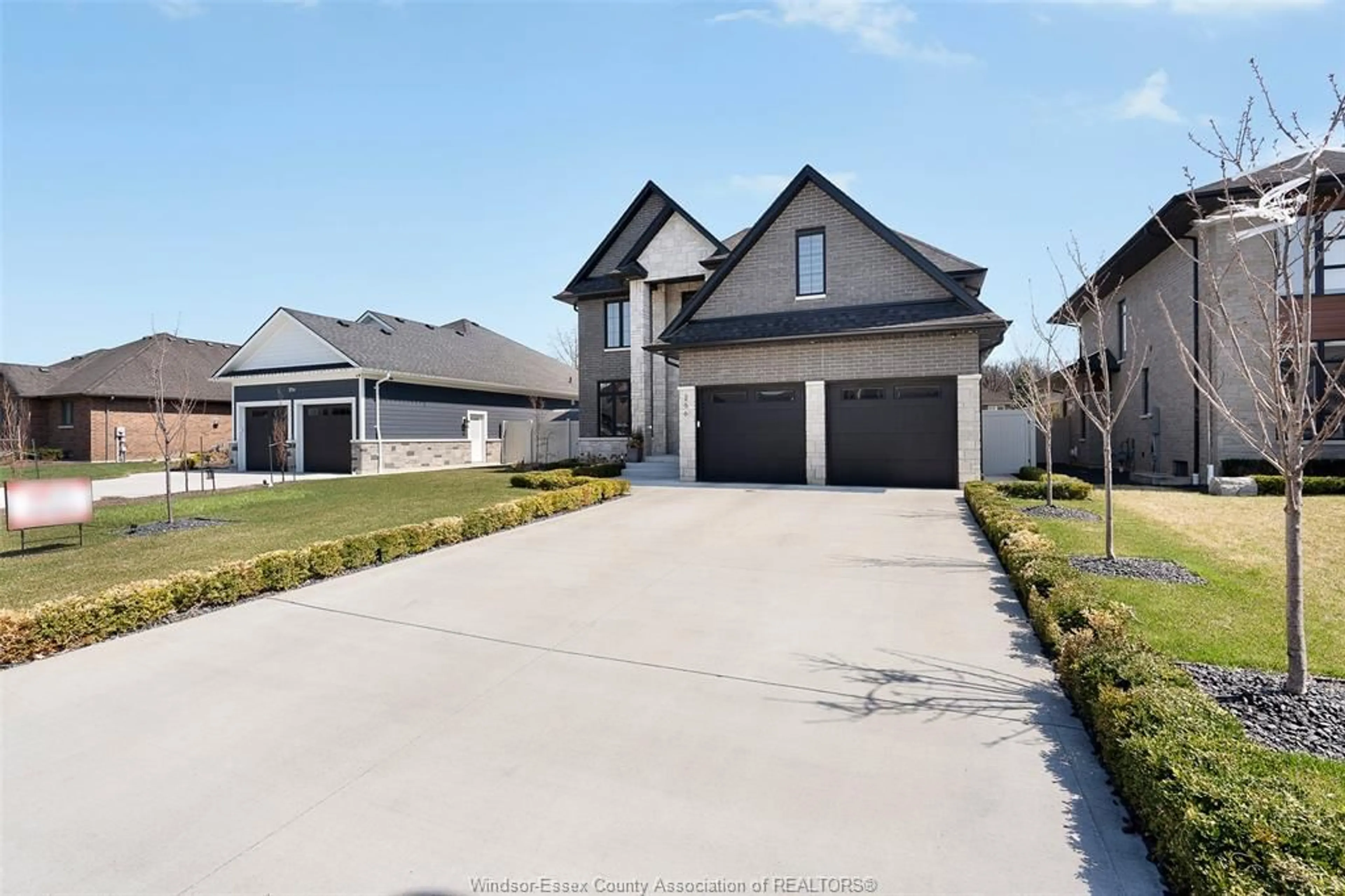 A pic from outside/outdoor area/front of a property/back of a property/a pic from drone, street for 256 XAVIER Cir, Lakeshore Ontario N0R 1A0