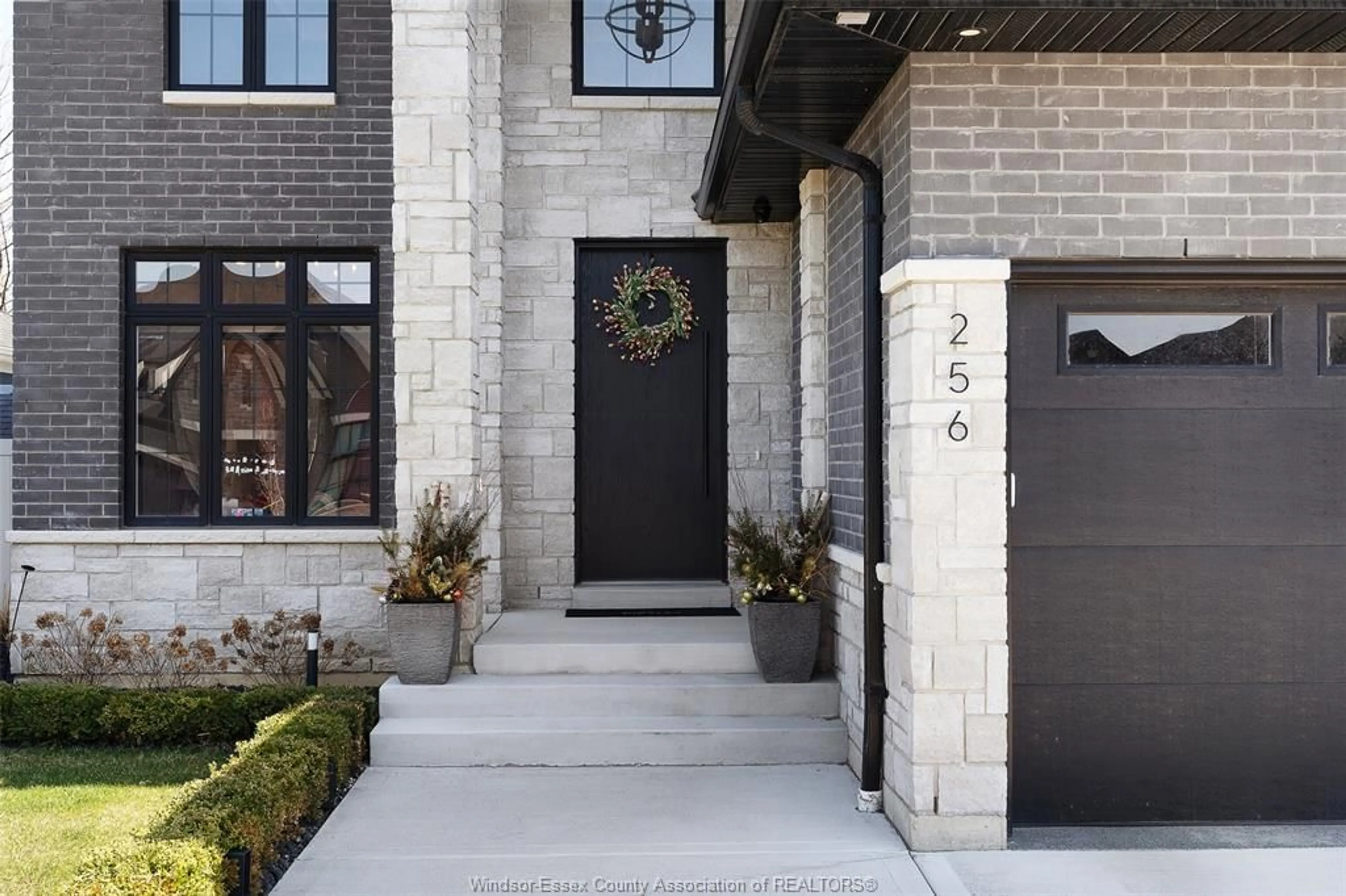 Home with brick exterior material, street for 256 XAVIER Cir, Lakeshore Ontario N0R 1A0