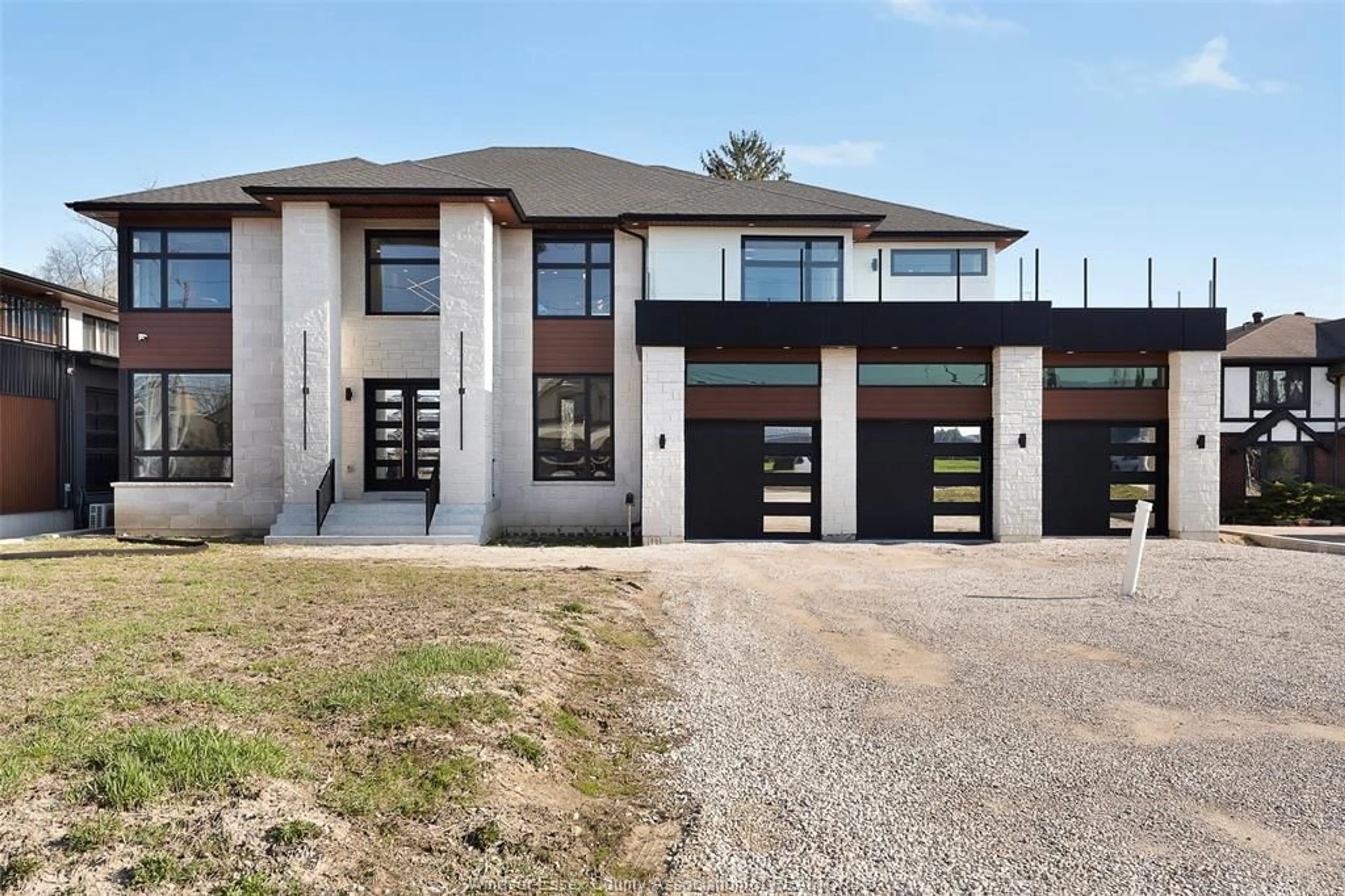 Home with brick exterior material, street for 8535 RIVERSIDE Dr, Windsor Ontario N8S 1G1