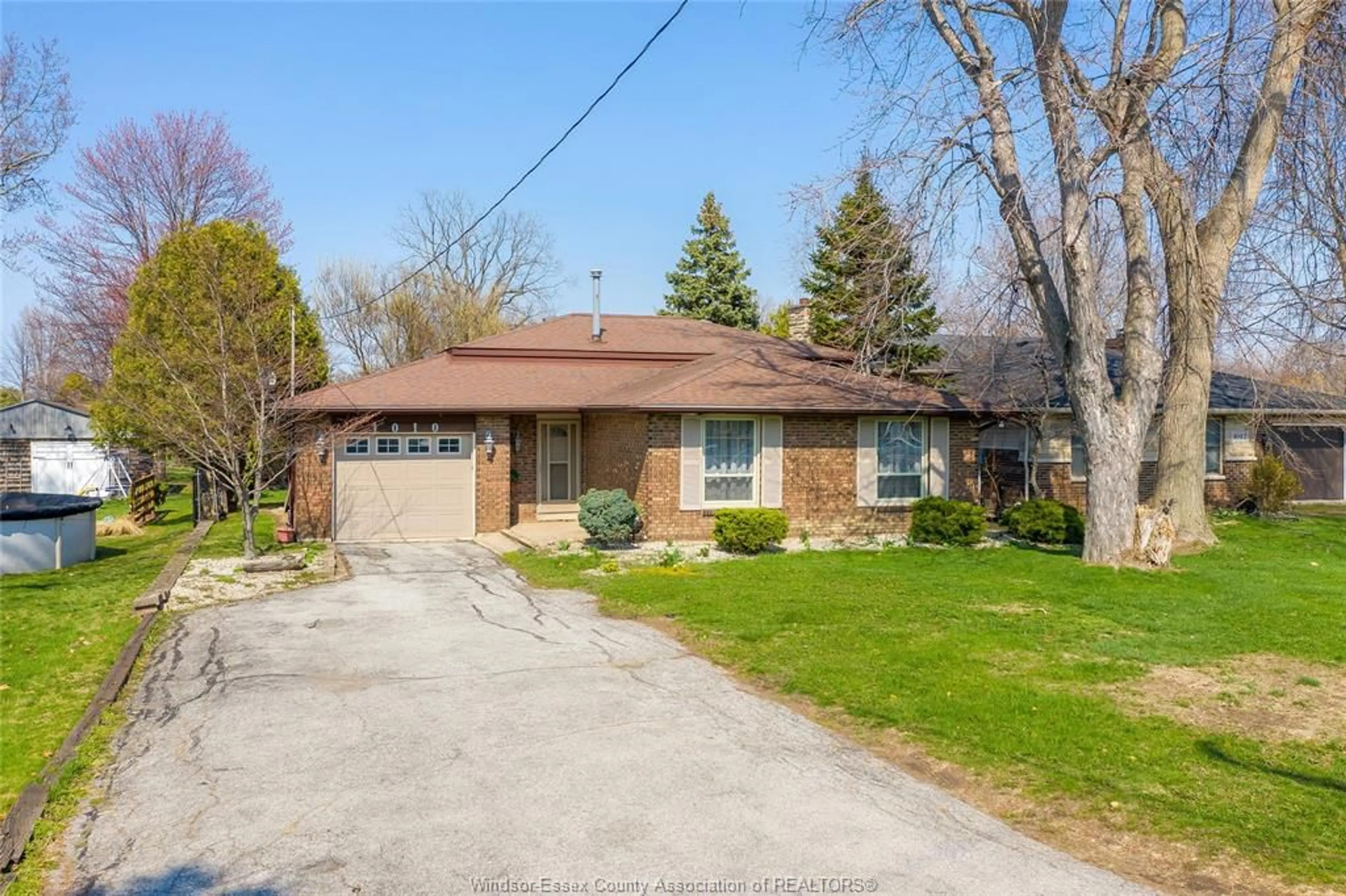 Home with brick exterior material, street for 1010 COUNTY Rd #22, Lakeshore Ontario N0R 1A0