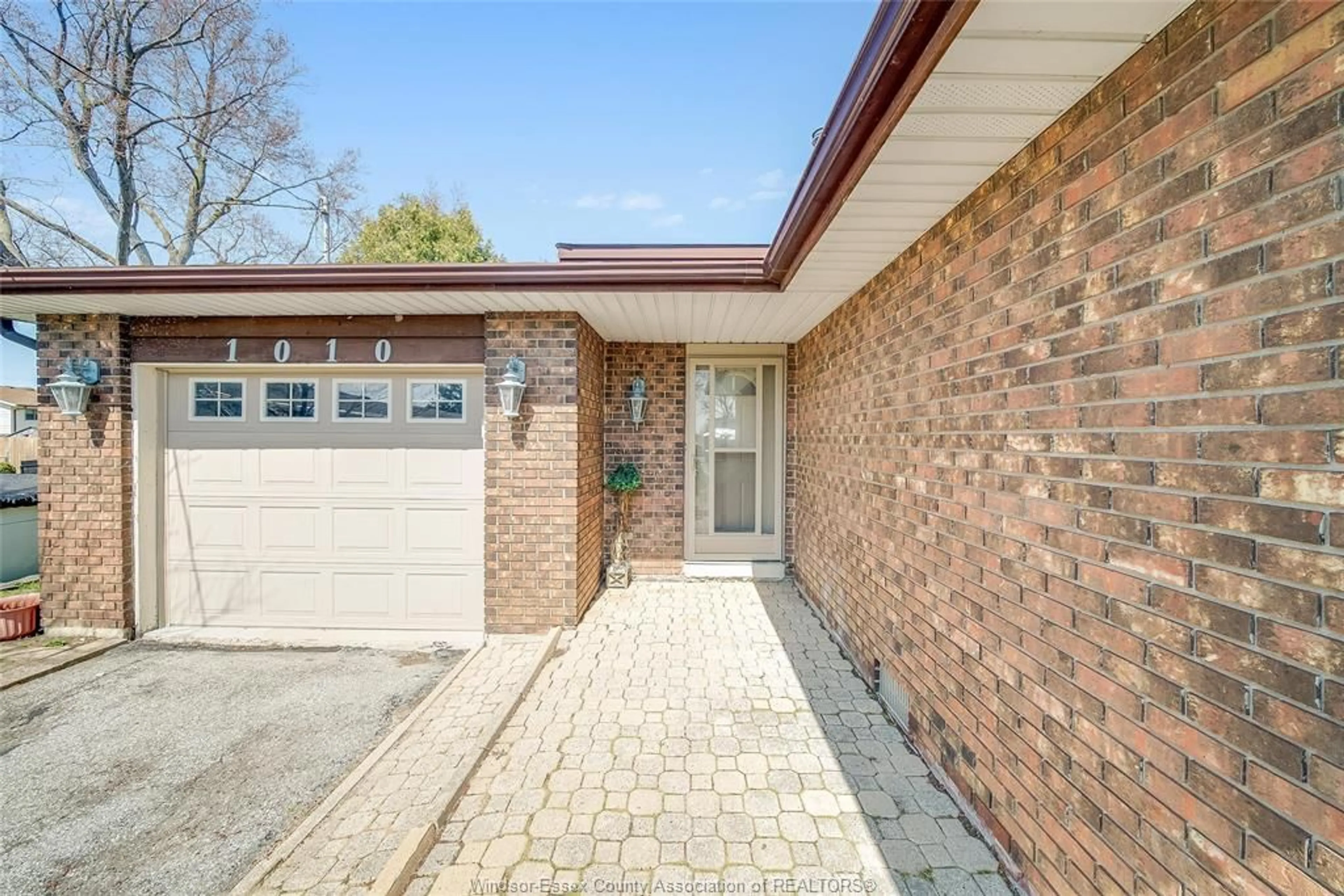 Home with brick exterior material, street for 1010 COUNTY Rd #22, Lakeshore Ontario N0R 1A0