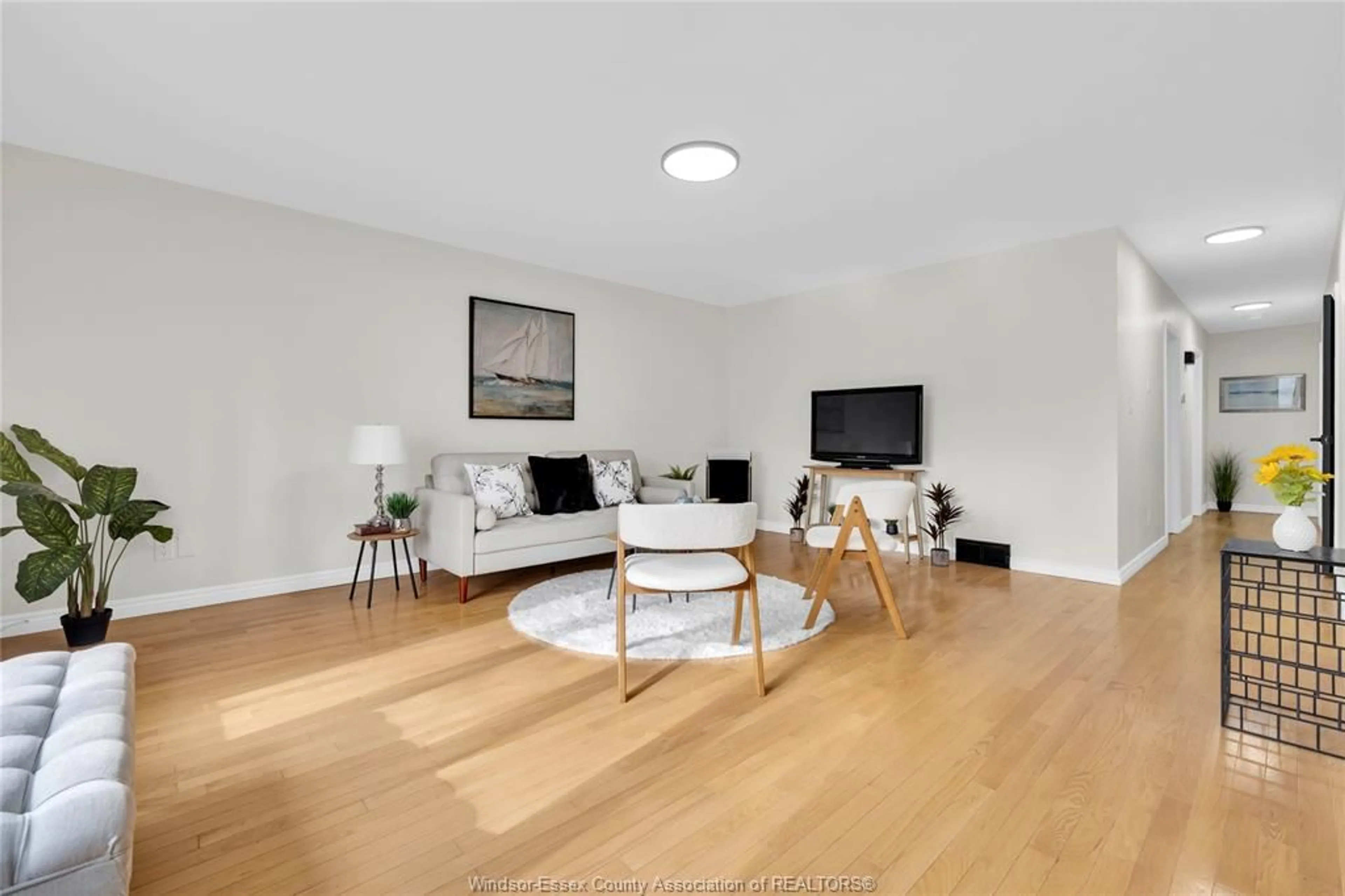 Living room with furniture, wood/laminate floor for 556 CLOVER, Windsor Ontario N8P 1C6