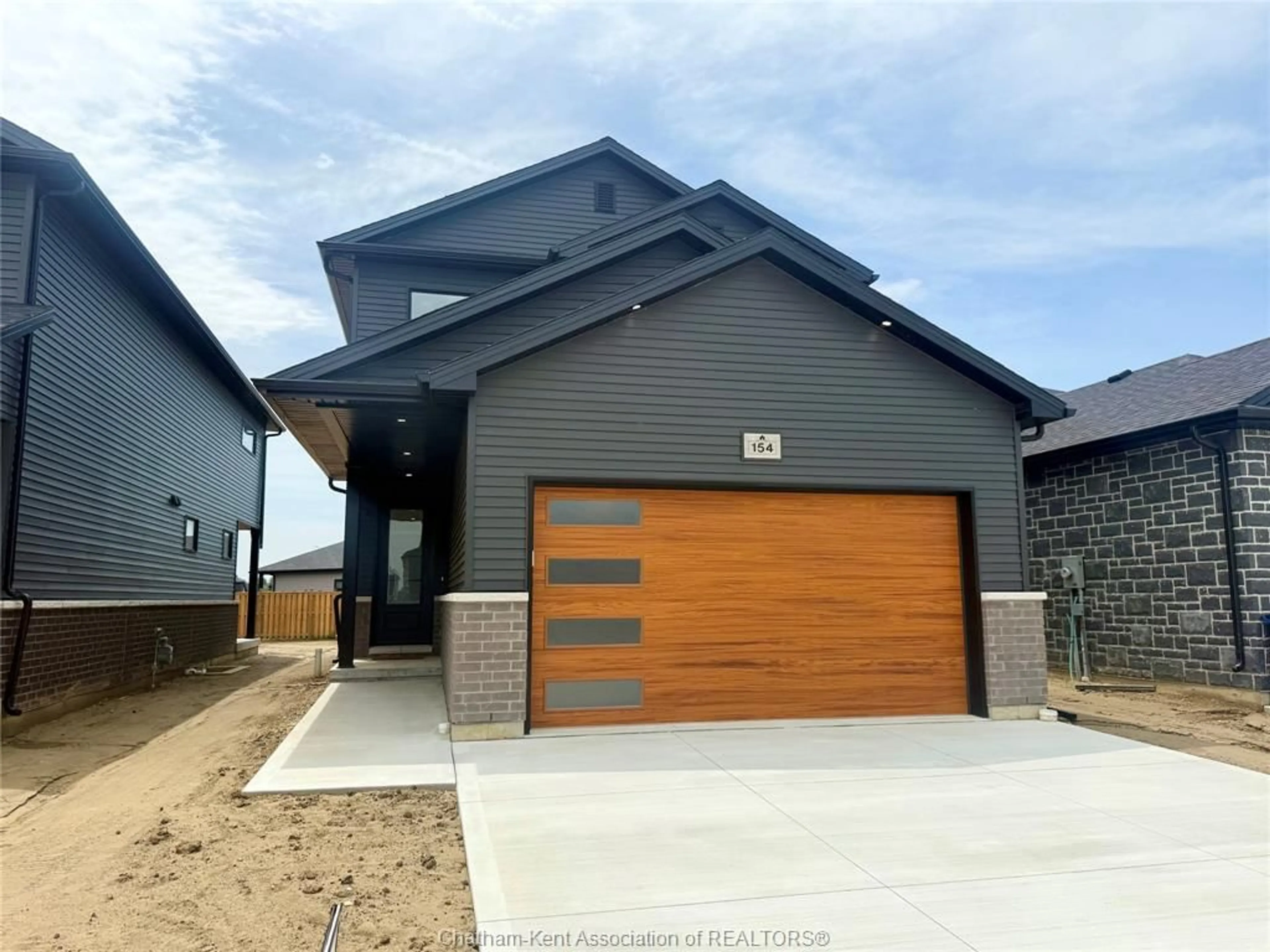 Home with brick exterior material, street for 199 IRONWOOD Trail, Chatham Ontario N7M 0T3