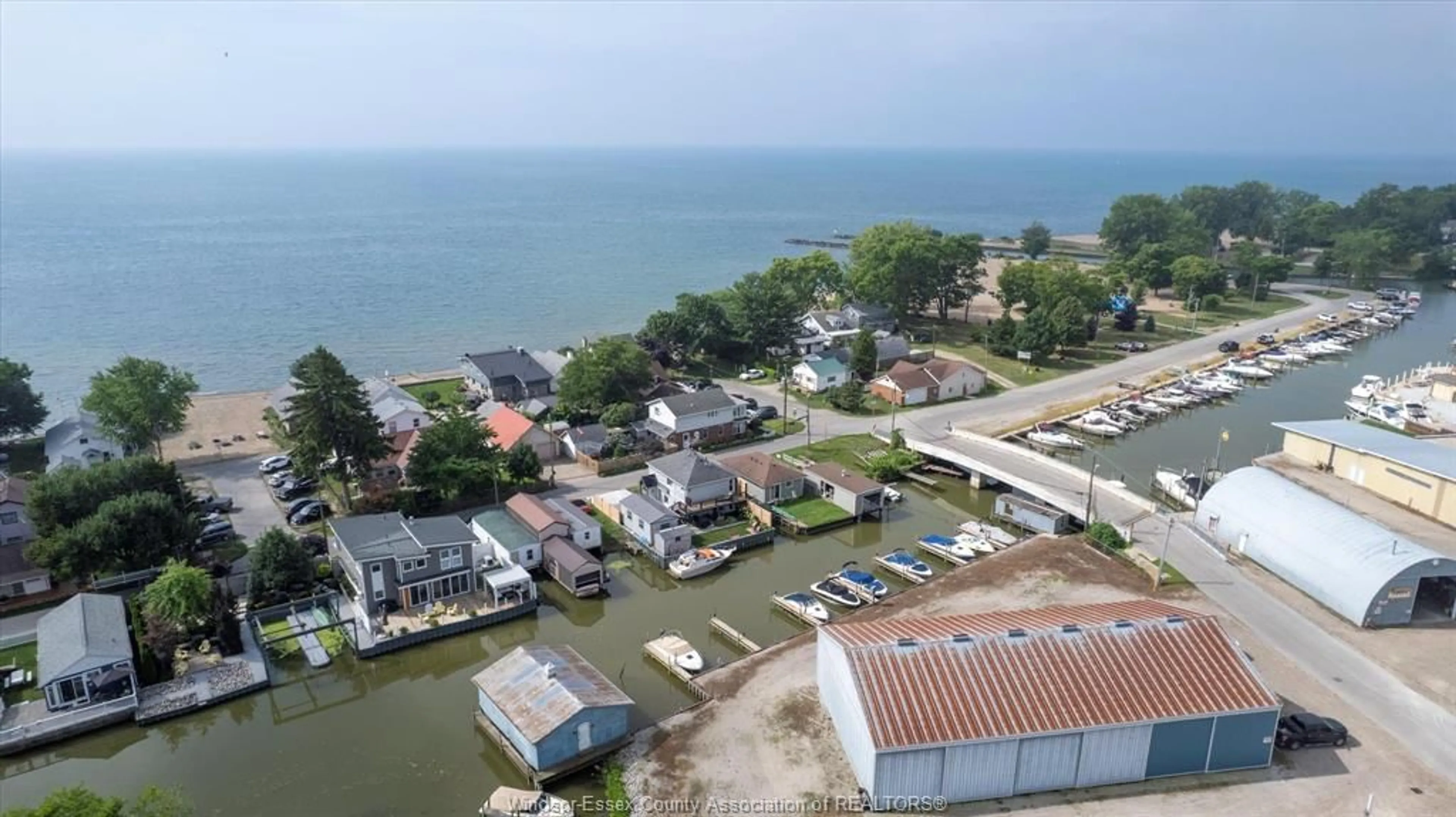 A pic from outside/outdoor area/front of a property/back of a property/a pic from drone, water/lake/river/ocean view for 848 CEDAR ISLAND Dr, Kingsville Ontario N9Y 3W1