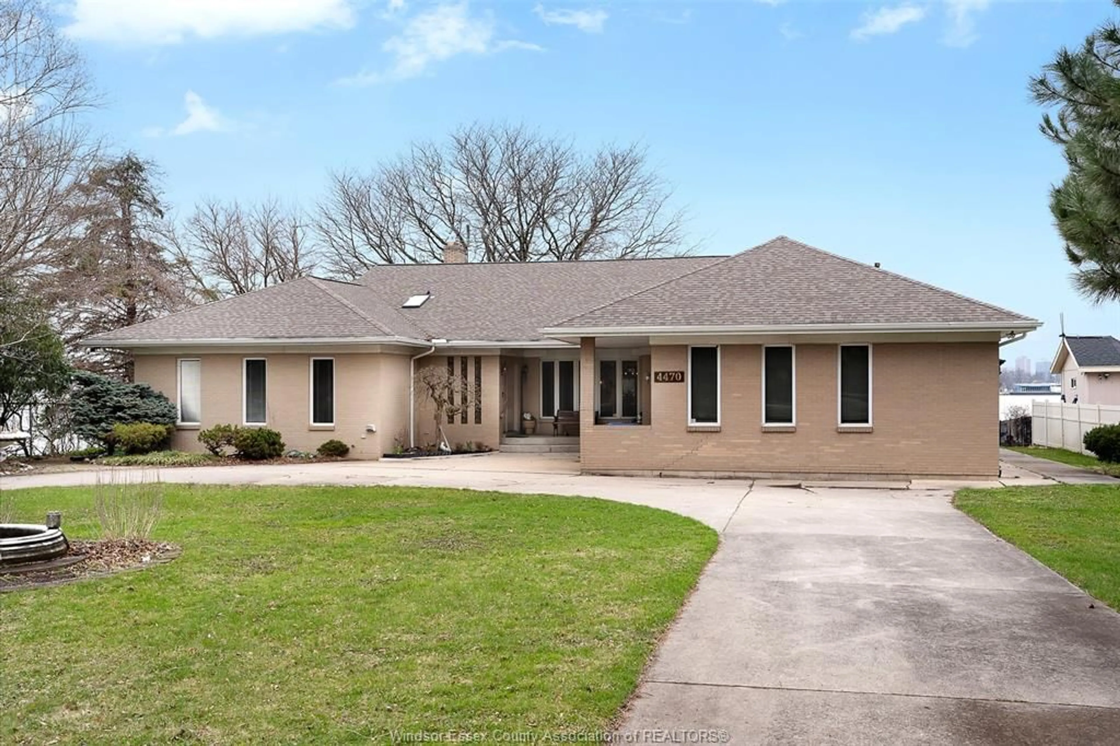 Home with brick exterior material, street for 4470 Riverside, Windsor Ontario N8Y 1B8