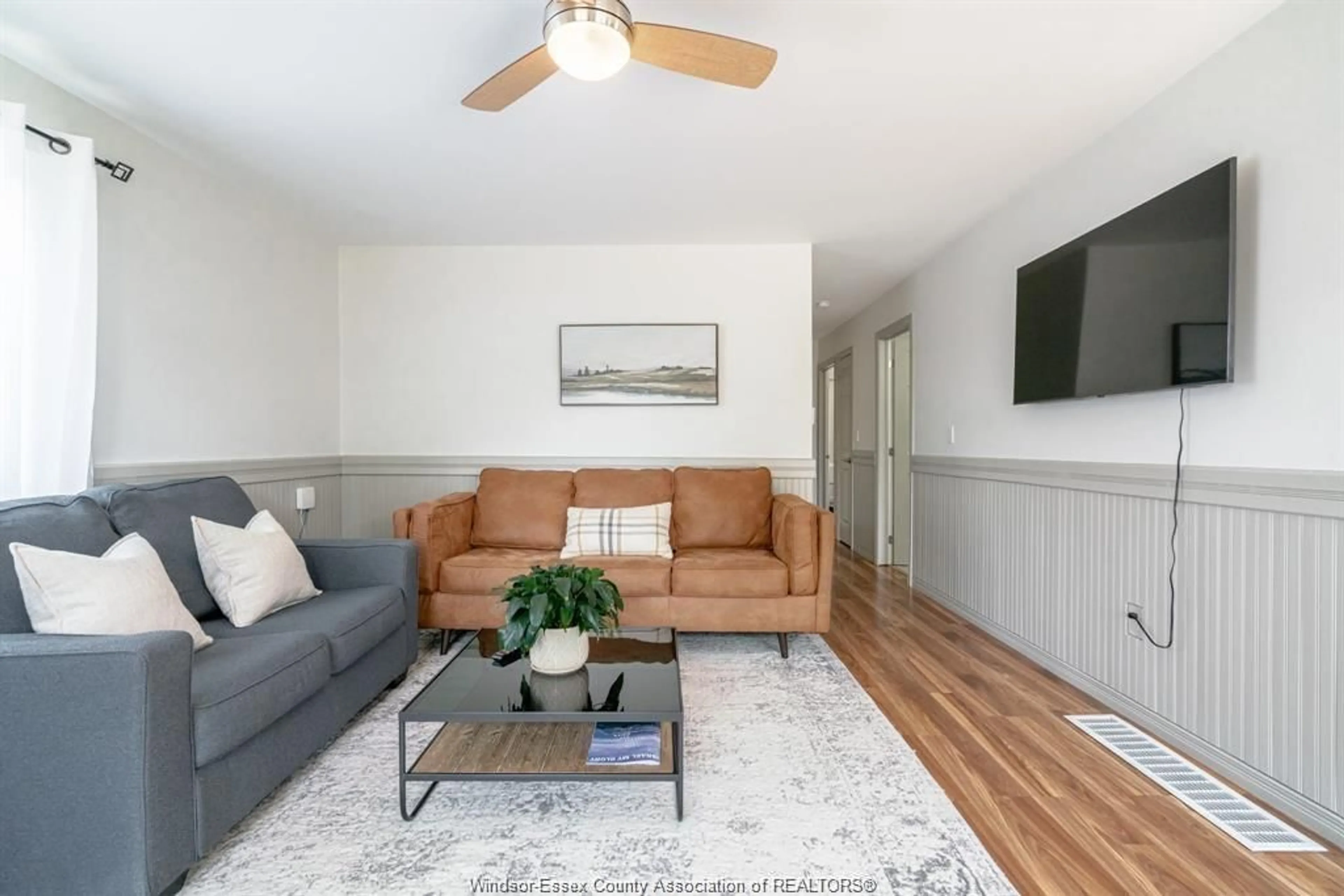 Living room with furniture, wood/laminate floor for 166 STIRLING St, Lakeshore Ontario N0R 1A0