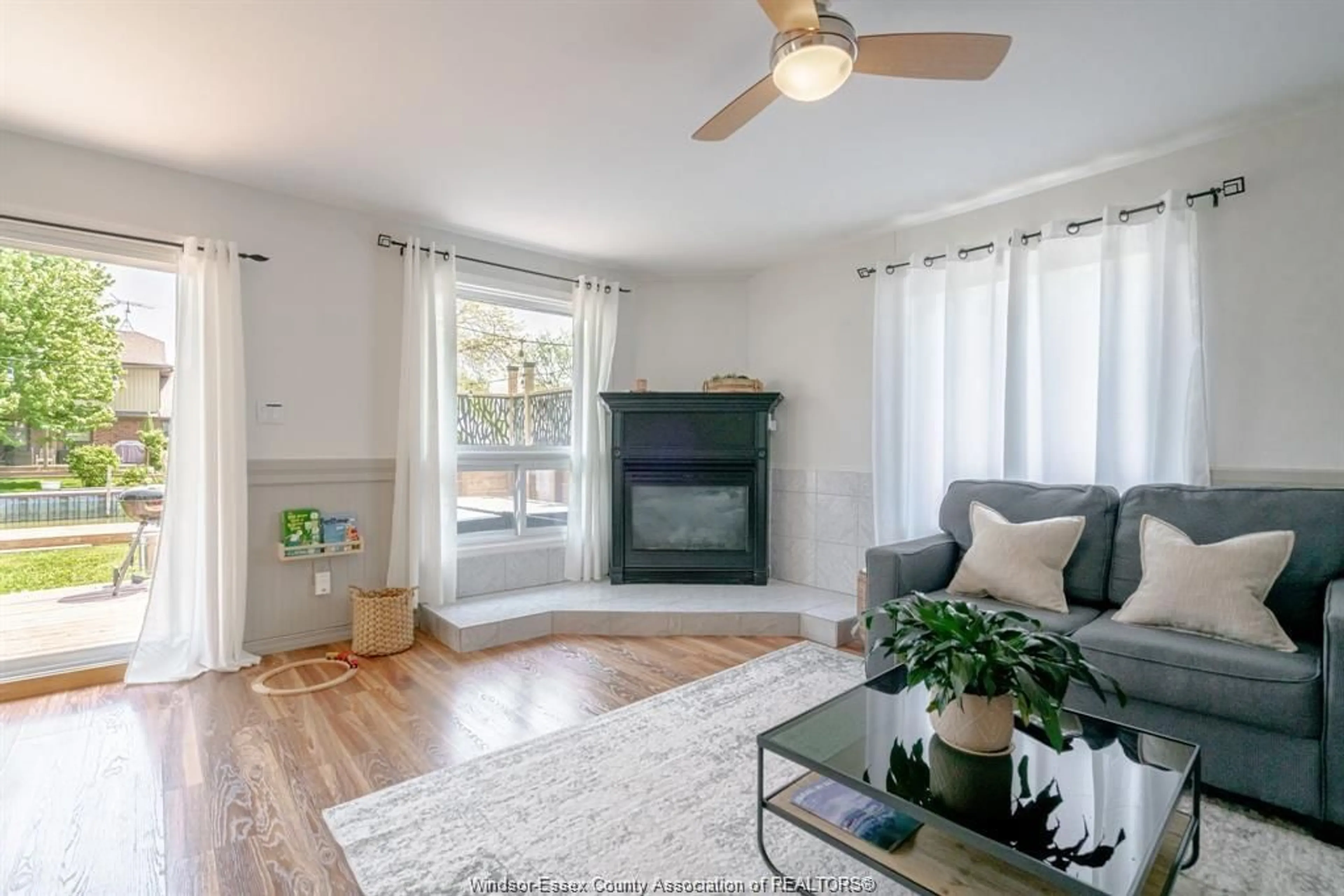 Living room with furniture, wood/laminate floor for 166 STIRLING St, Lakeshore Ontario N0R 1A0