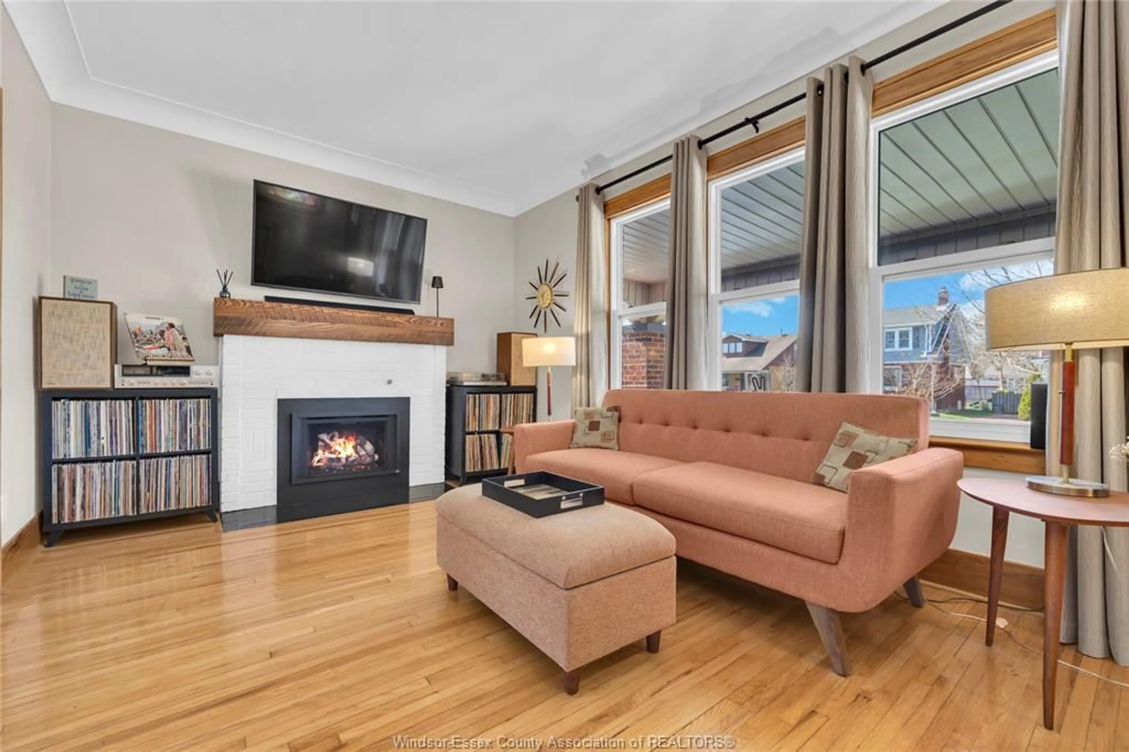 Living room with furniture, wood/laminate floor for 2150 LINCOLN Rd, Windsor Ontario N8W 2R1